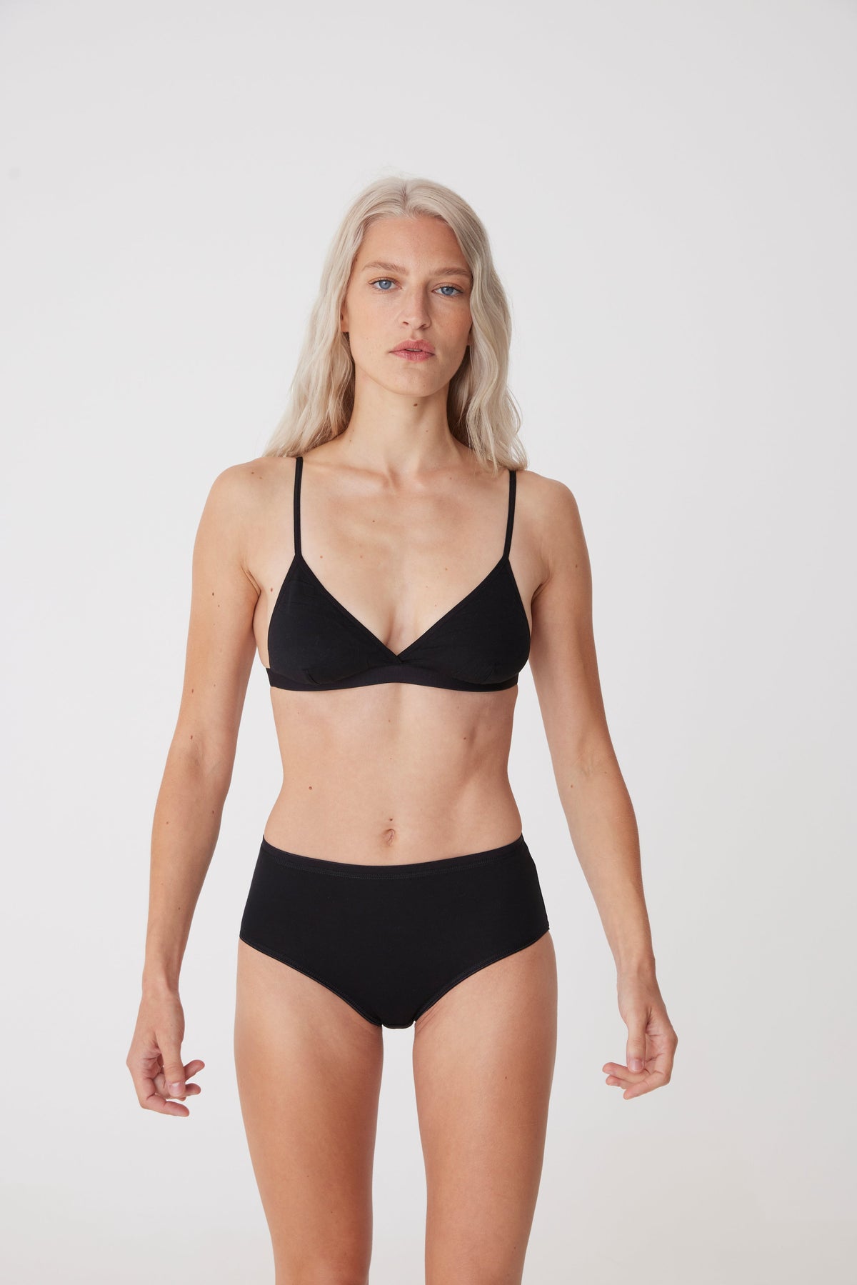 blonde female wearing high rise brief in black