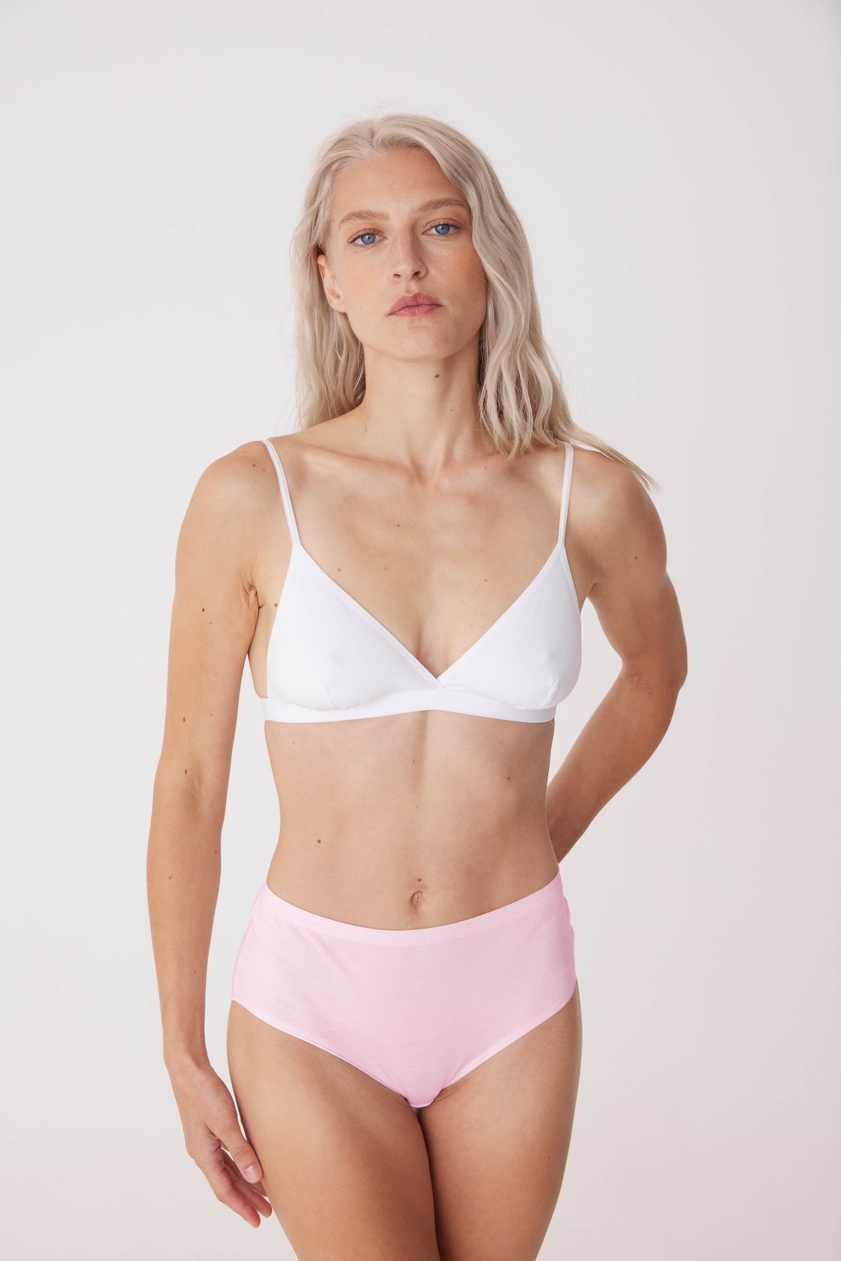 
            white, blonde female in soft pink high rise brief