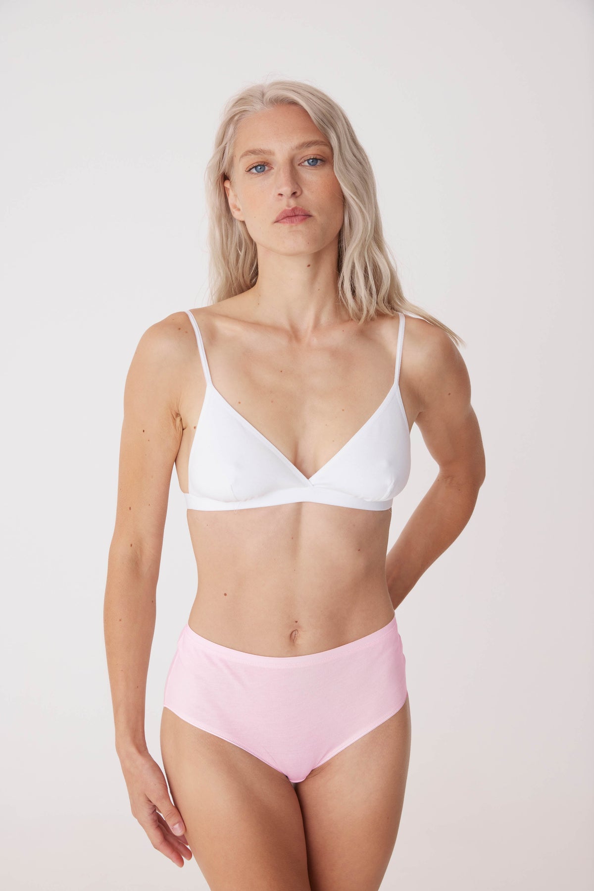 white, blonde female in soft pink high rise brief