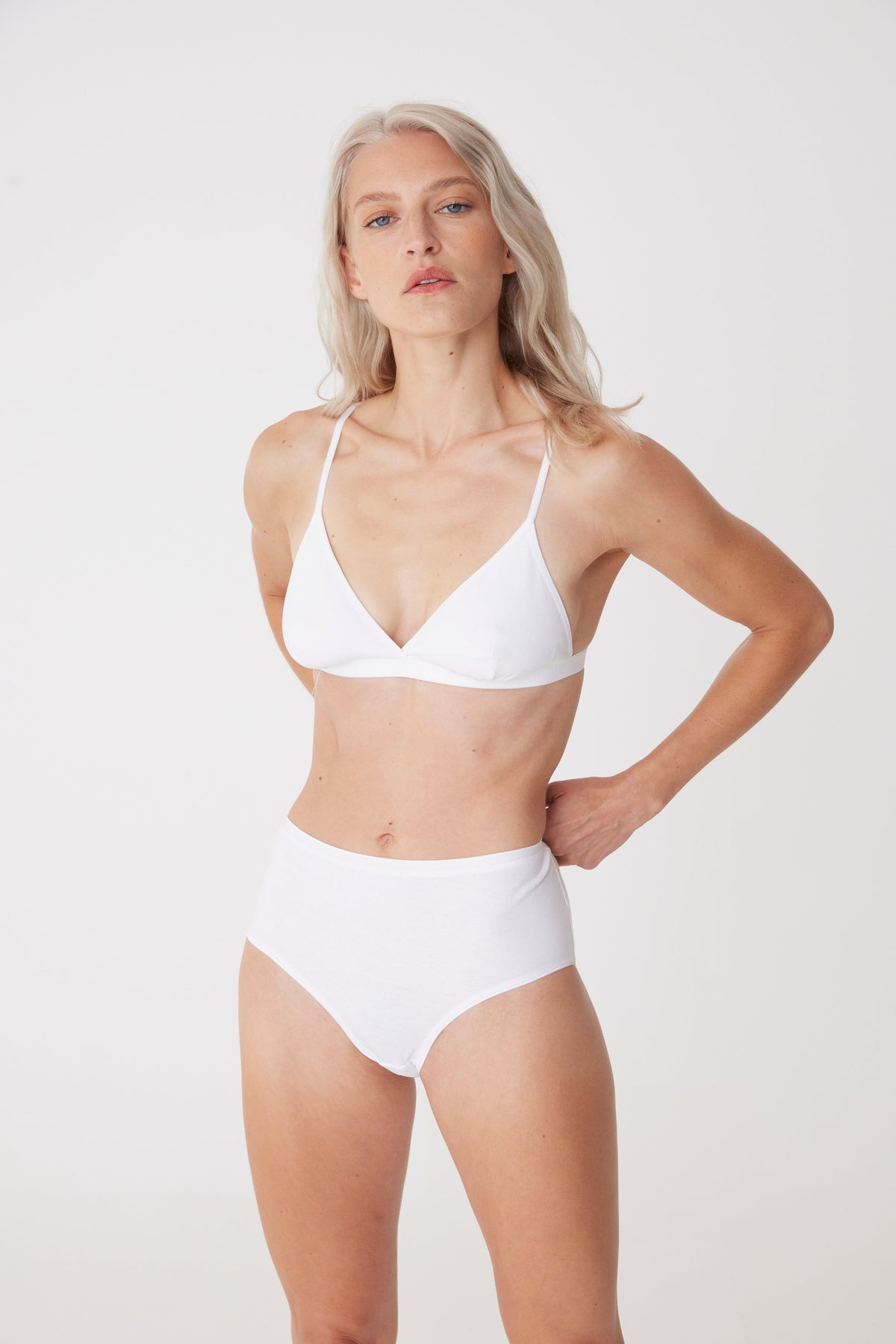 blonde, white female in white high rise brief front thigh up