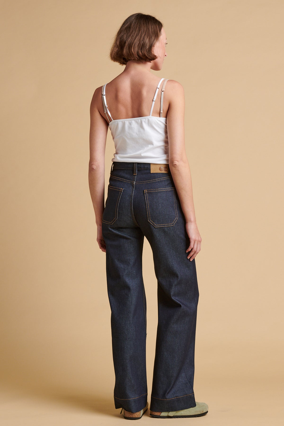 The back of female wearing high rise wide leg Linda jean.