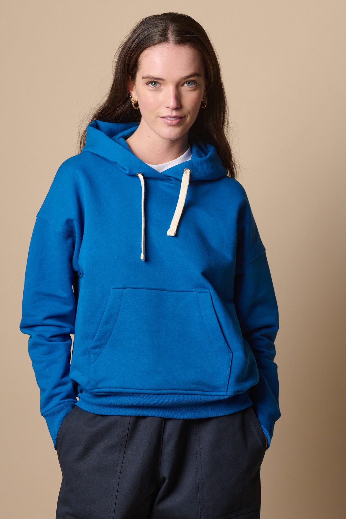
            Female wearing hooded sweatshirts in cobalt