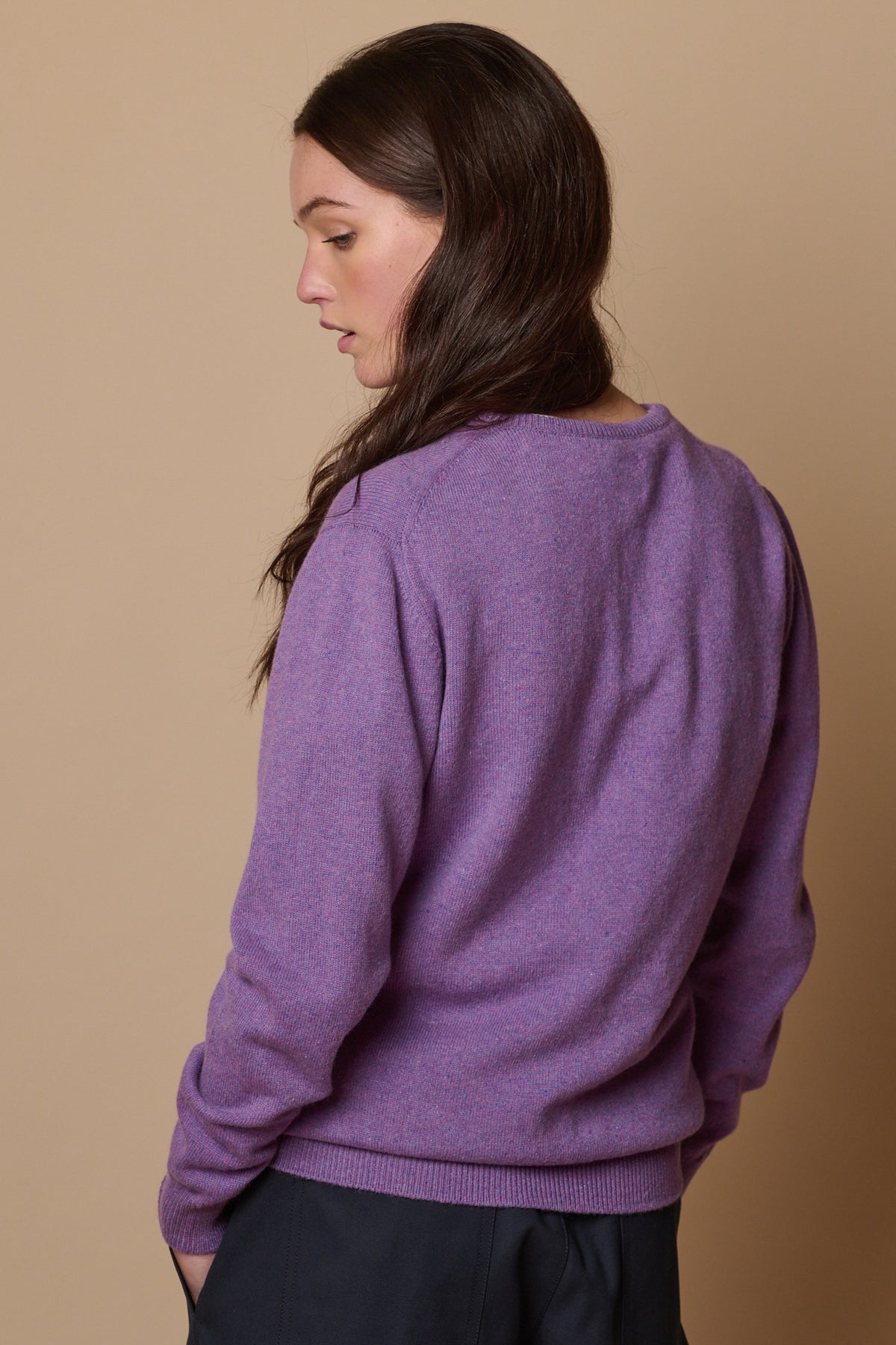 
            Back of female wearing lambswool crew neck thistle purple