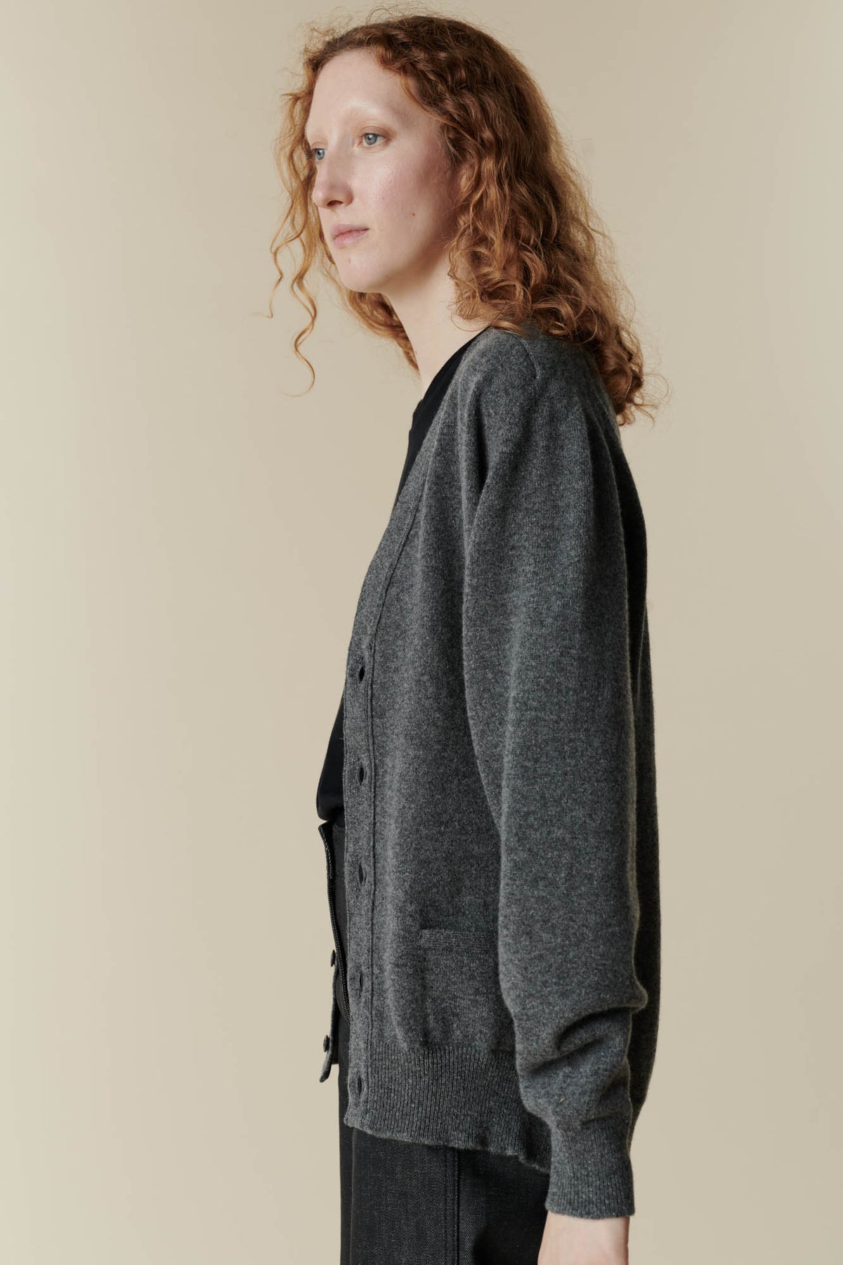 
            Image of side of female wearing v neck cardigan in charcoal 