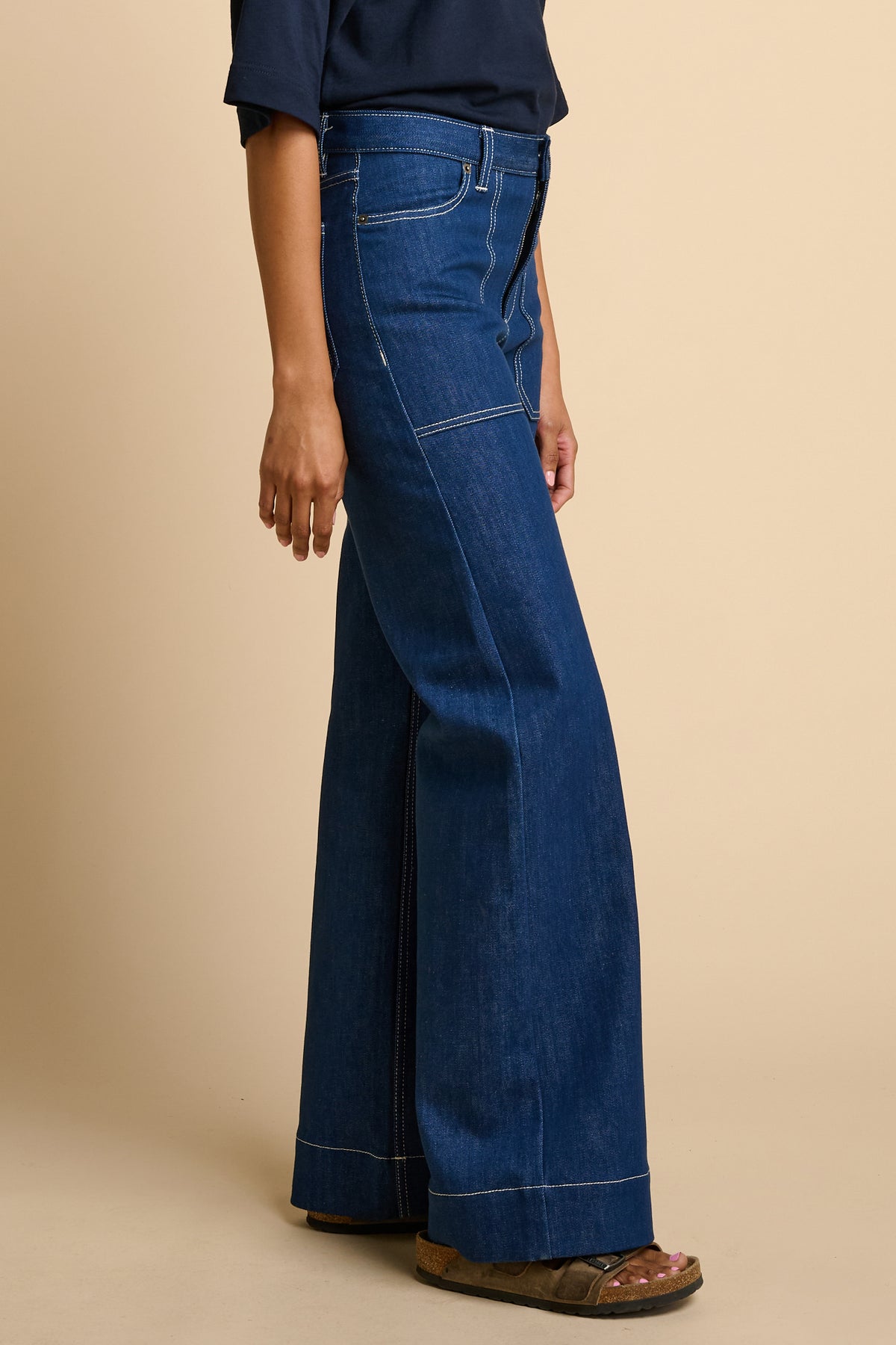 Woman wearing blue jeans.