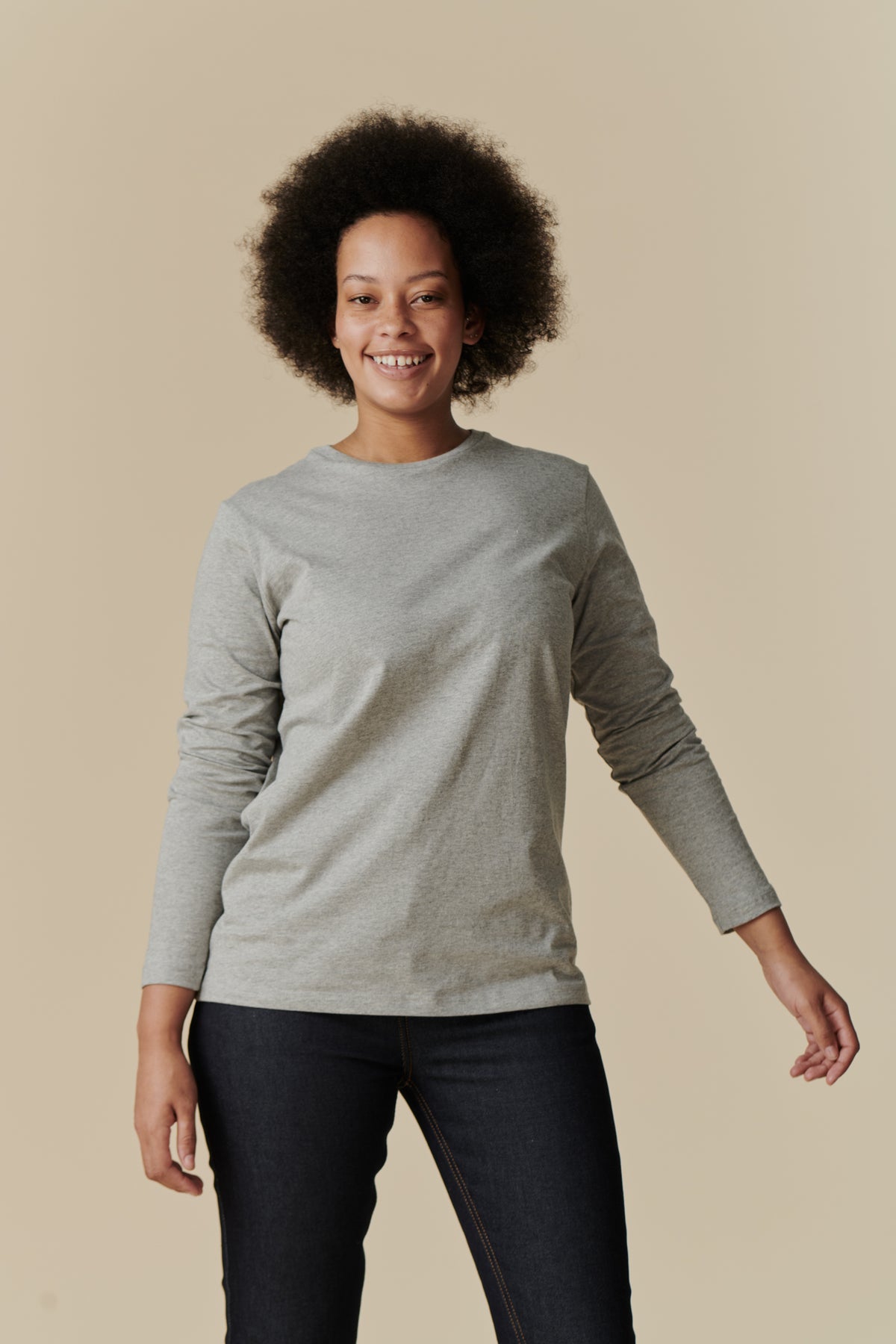 
            Thigh up front image of female wearing long sleeve t-shirt in grey marl