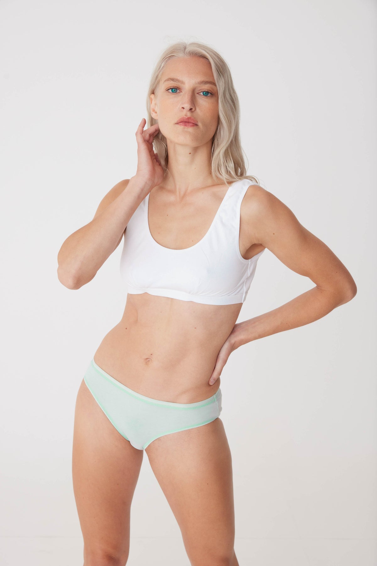 
            White female wearing sage low rise brief front thigh up