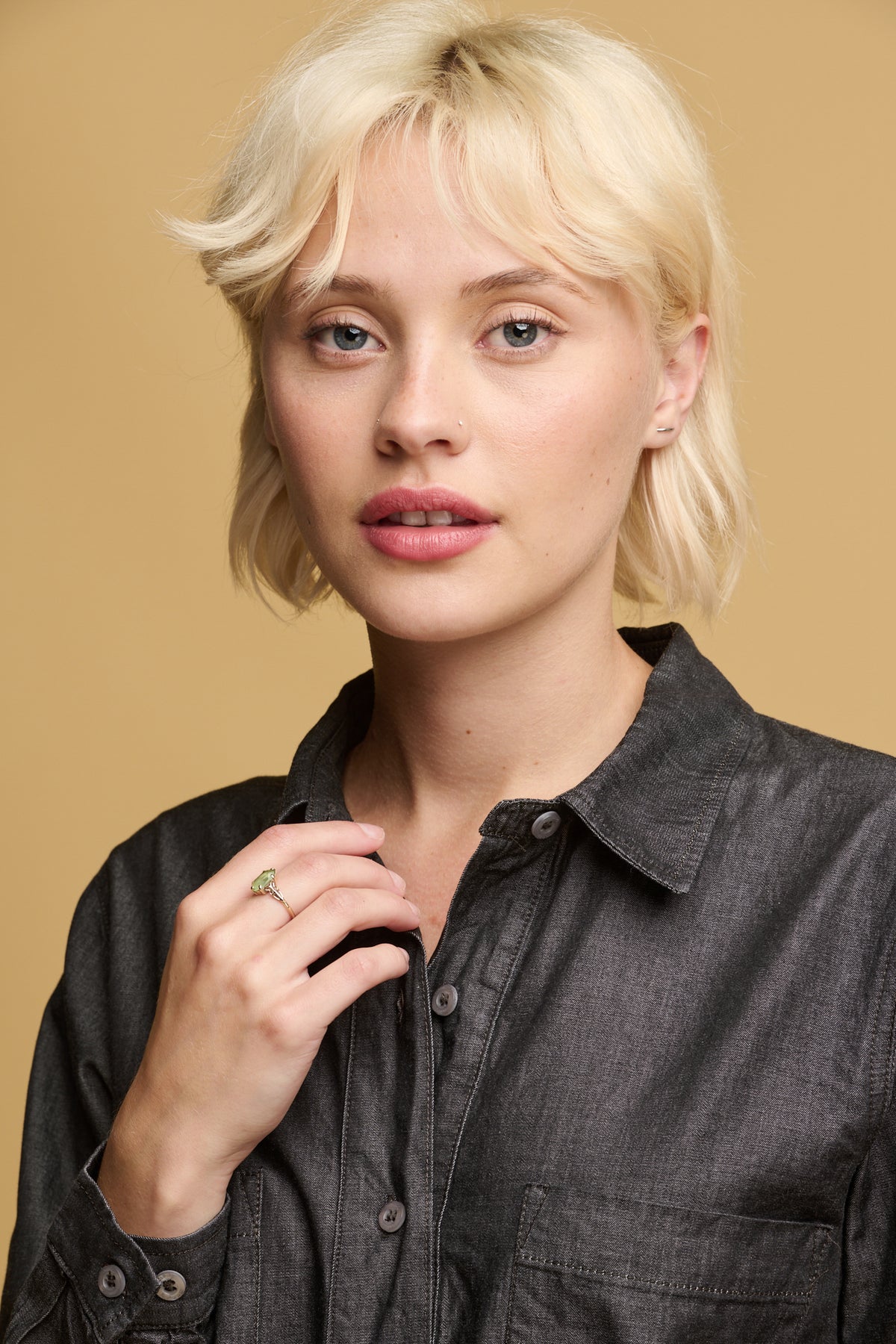 
            portrait of female wearing Olivia half placket shirt in lightweight denim