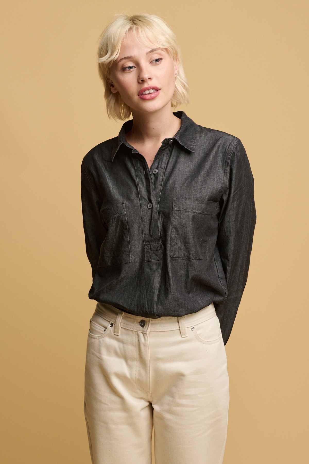 
            White female with short blonde hair wearing Gloria tapered jean in ecru  paired with Olivia lightweight denim shirt in black 