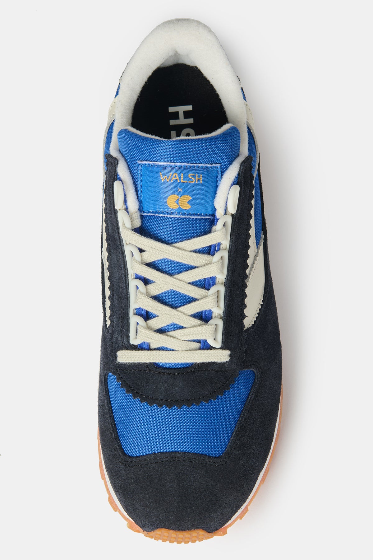 Top of women's Parlick style Trainer in blue/ navy/ off white with gold WALSH x CC on tongue of shoe