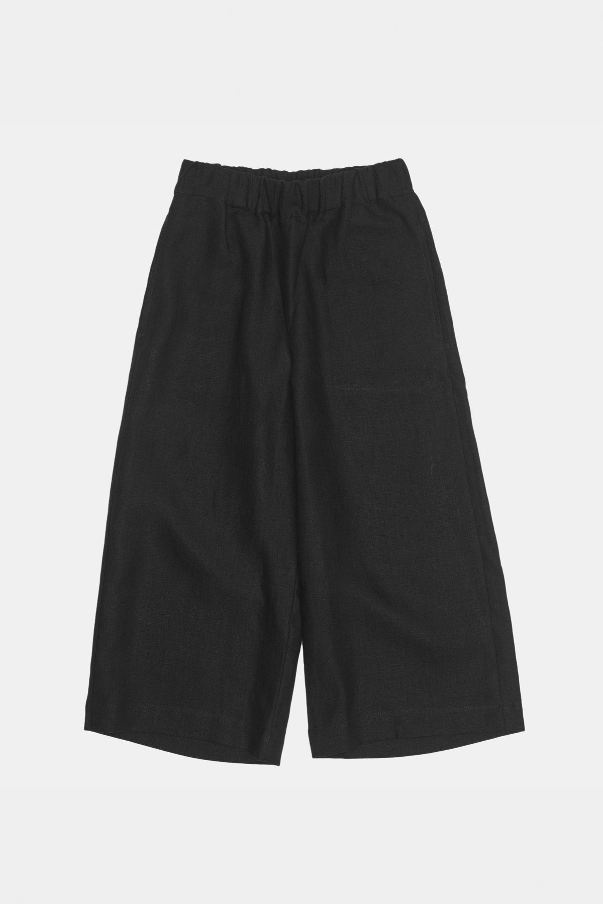 
            Overhead flat lay shot of women&#39;s short pj trousers in black linen