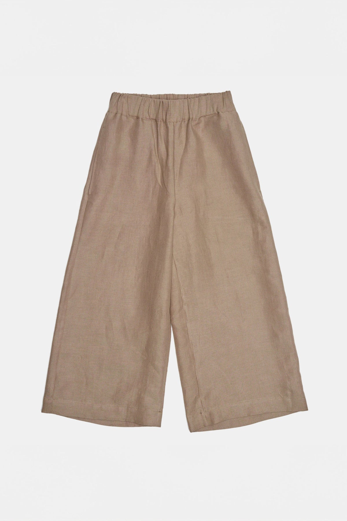 Overhead flat lay shot of womens short pj trousers in a sand coloured linen
