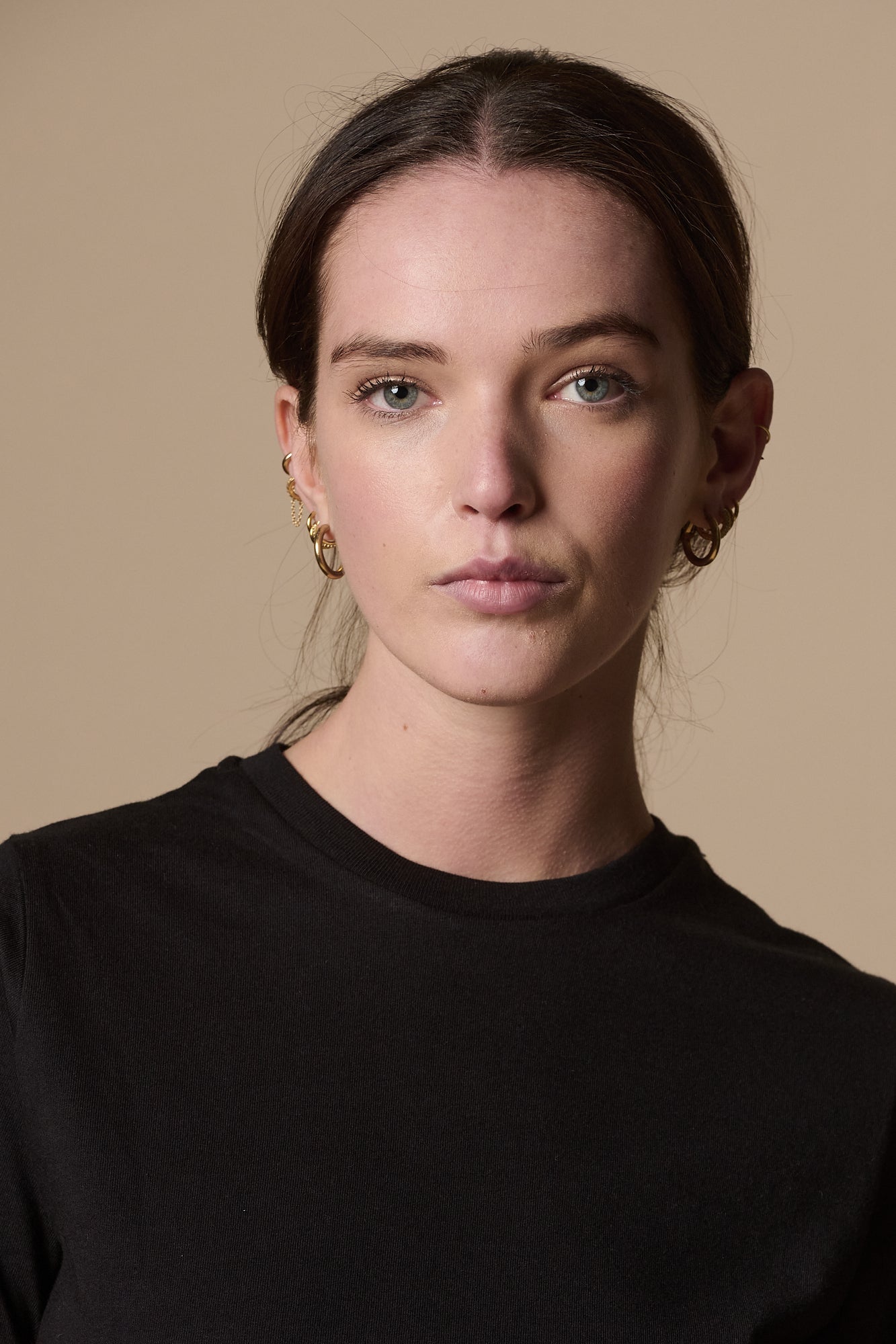 Portrait of female wearing short sleeve t shirt plastic free in black, crew neck