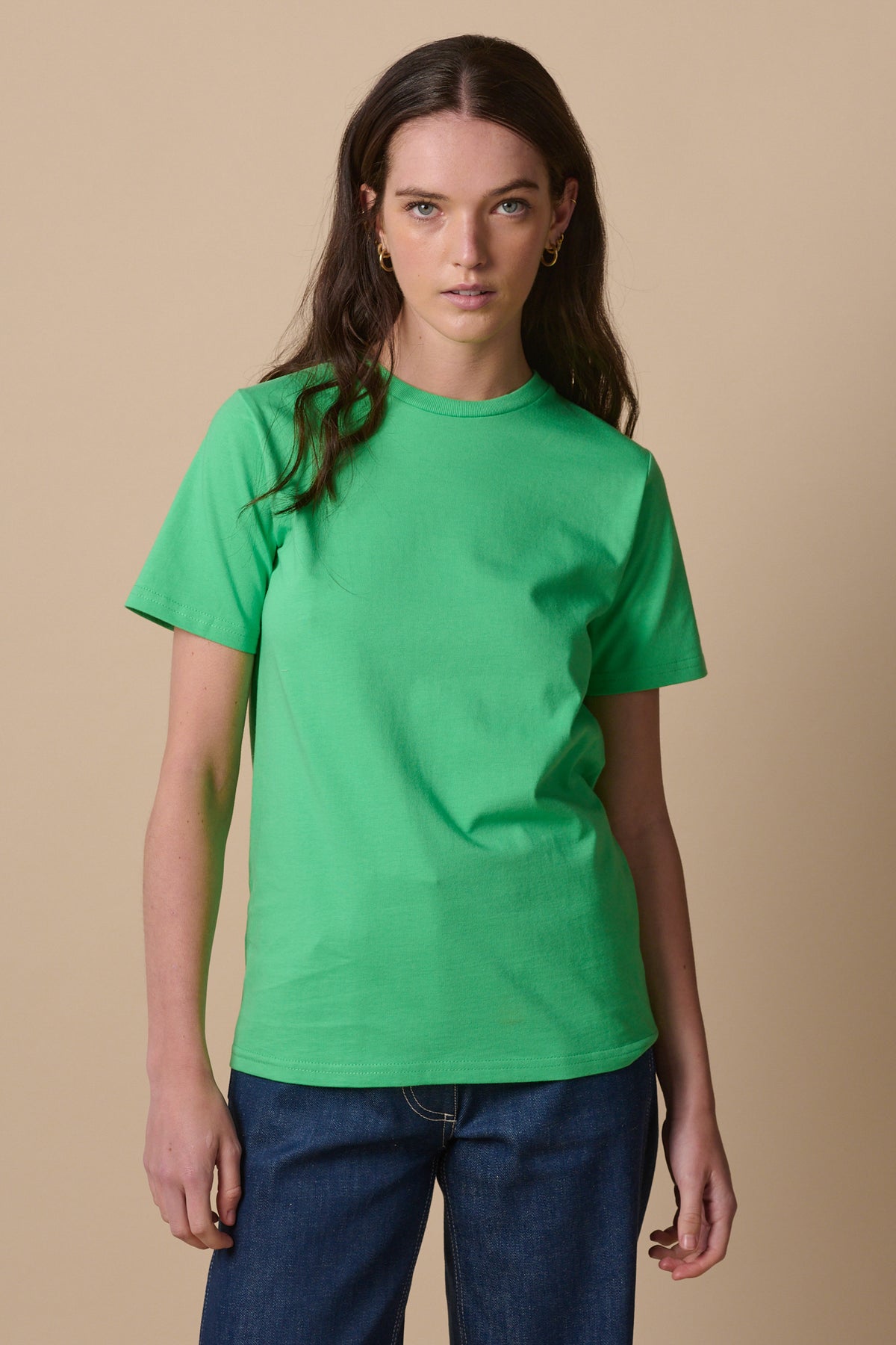 
            Thigh up image of white female wearing short sleeve crew neck t shirt in apple green 