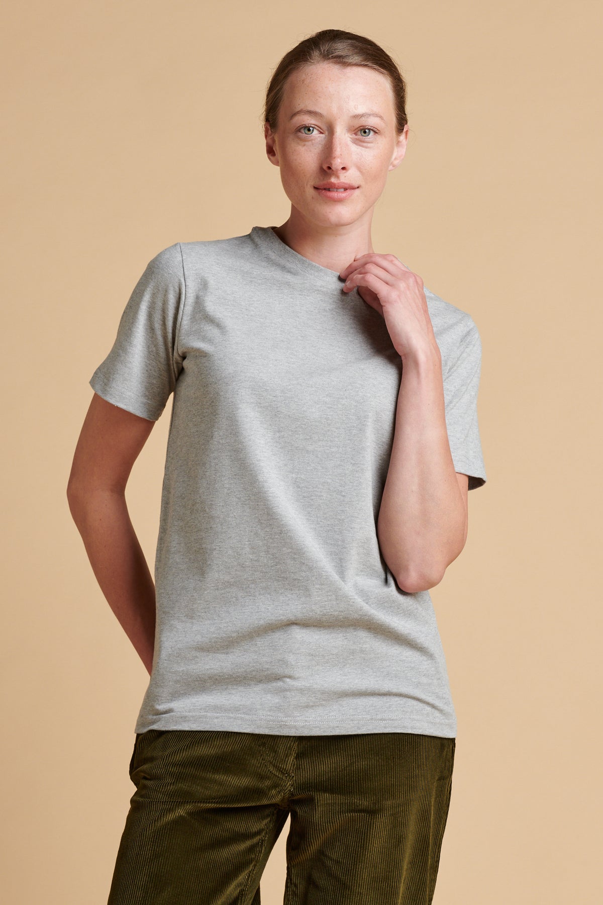 Female wearing short sleeve t shirt in grey marl.