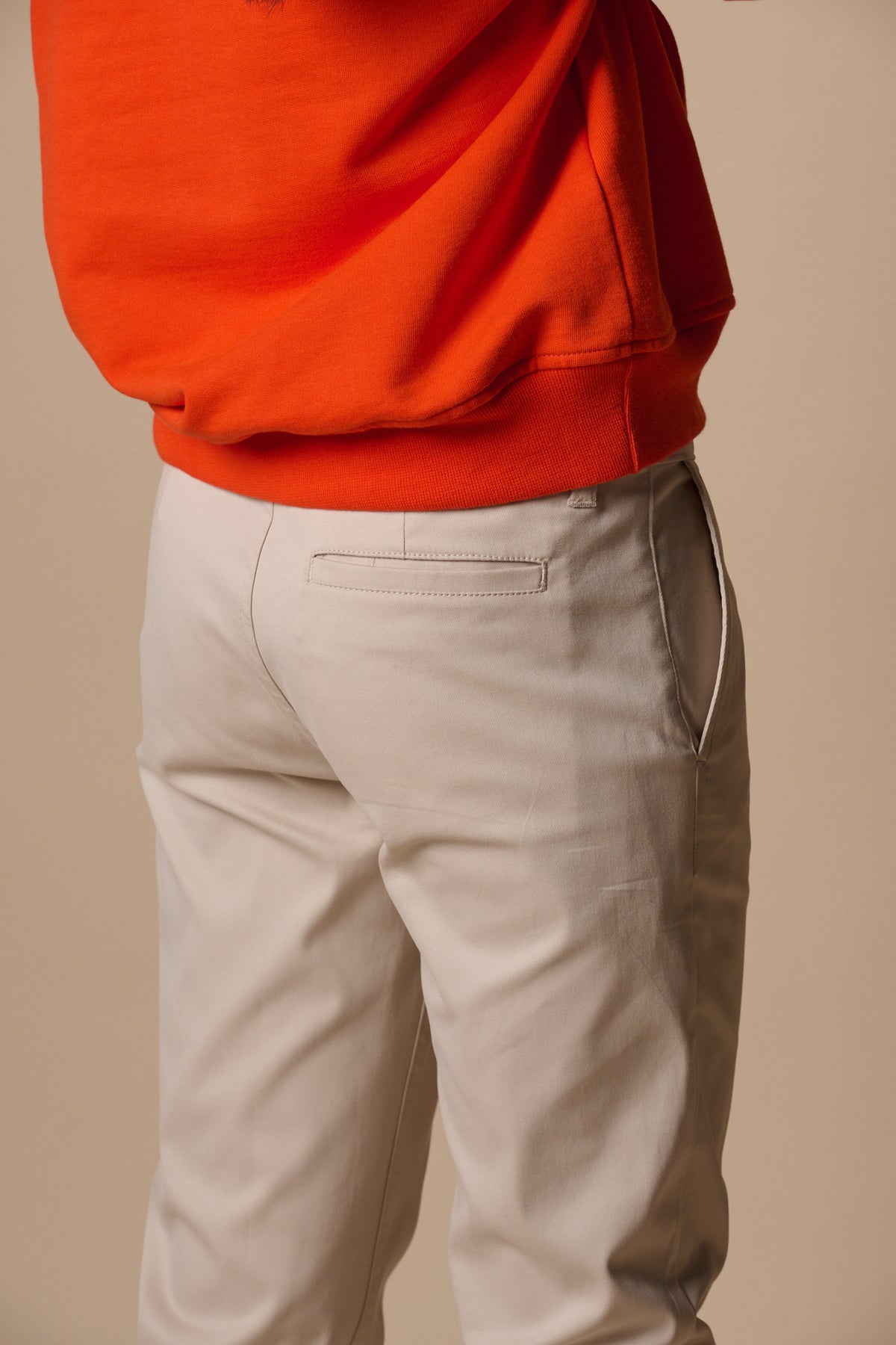 back pocket detail of slim stretch chinos in light stone