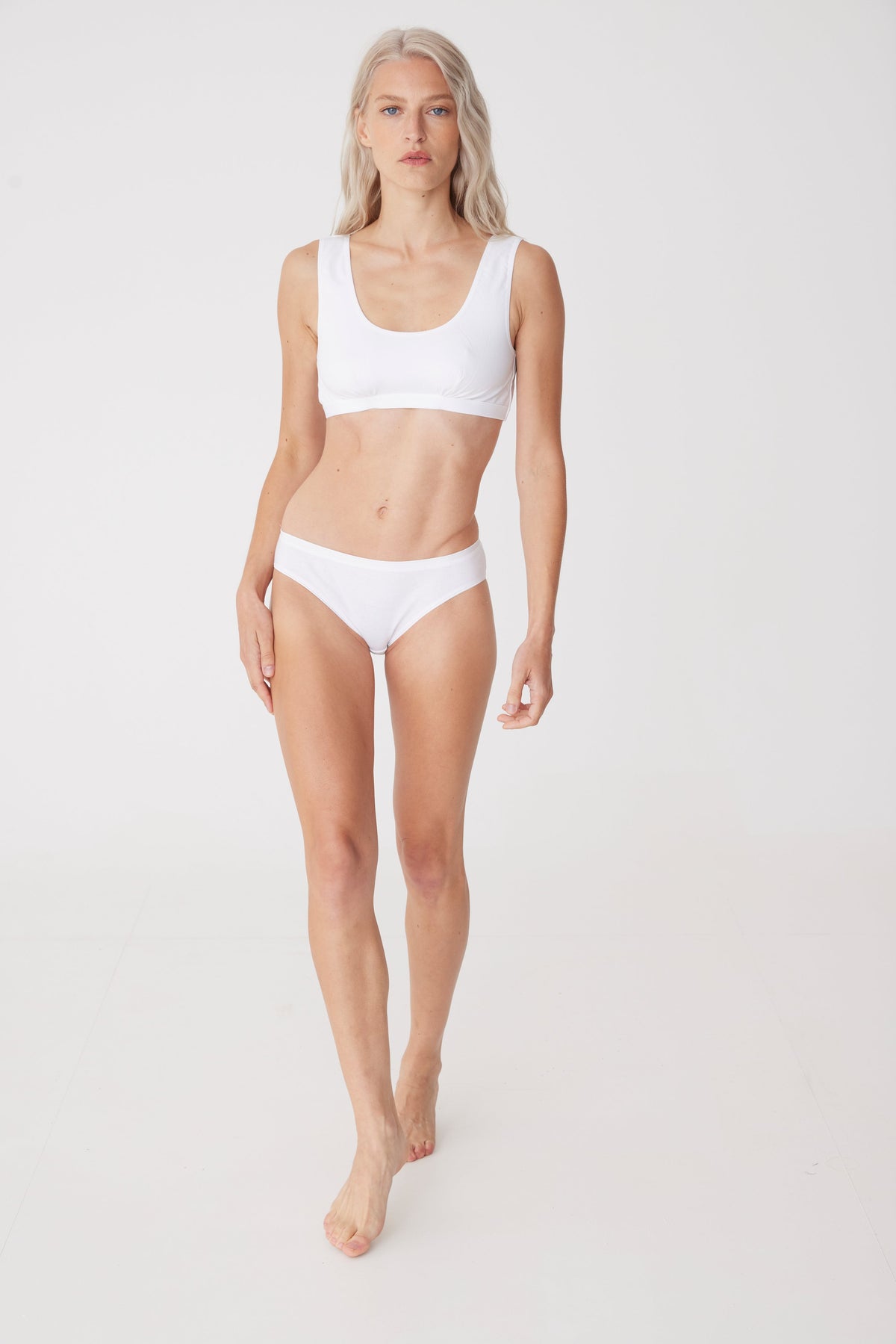 blonde female wearing white soft jersey bra