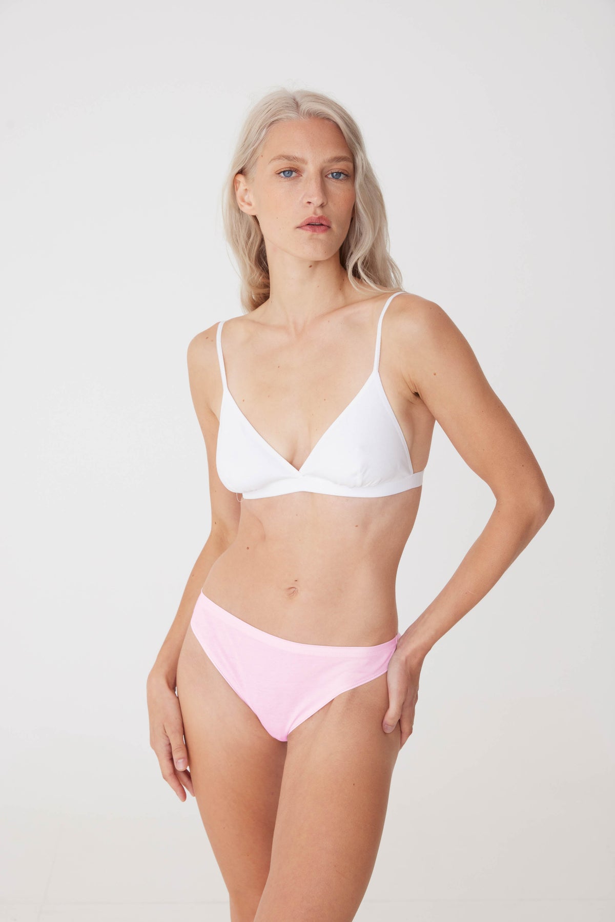 Blonde, white female wearing soft pink thong