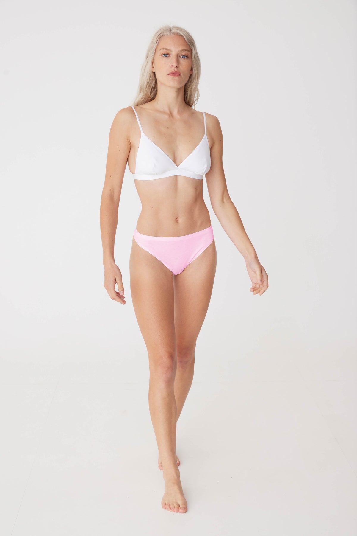 female wearing soft pink thong