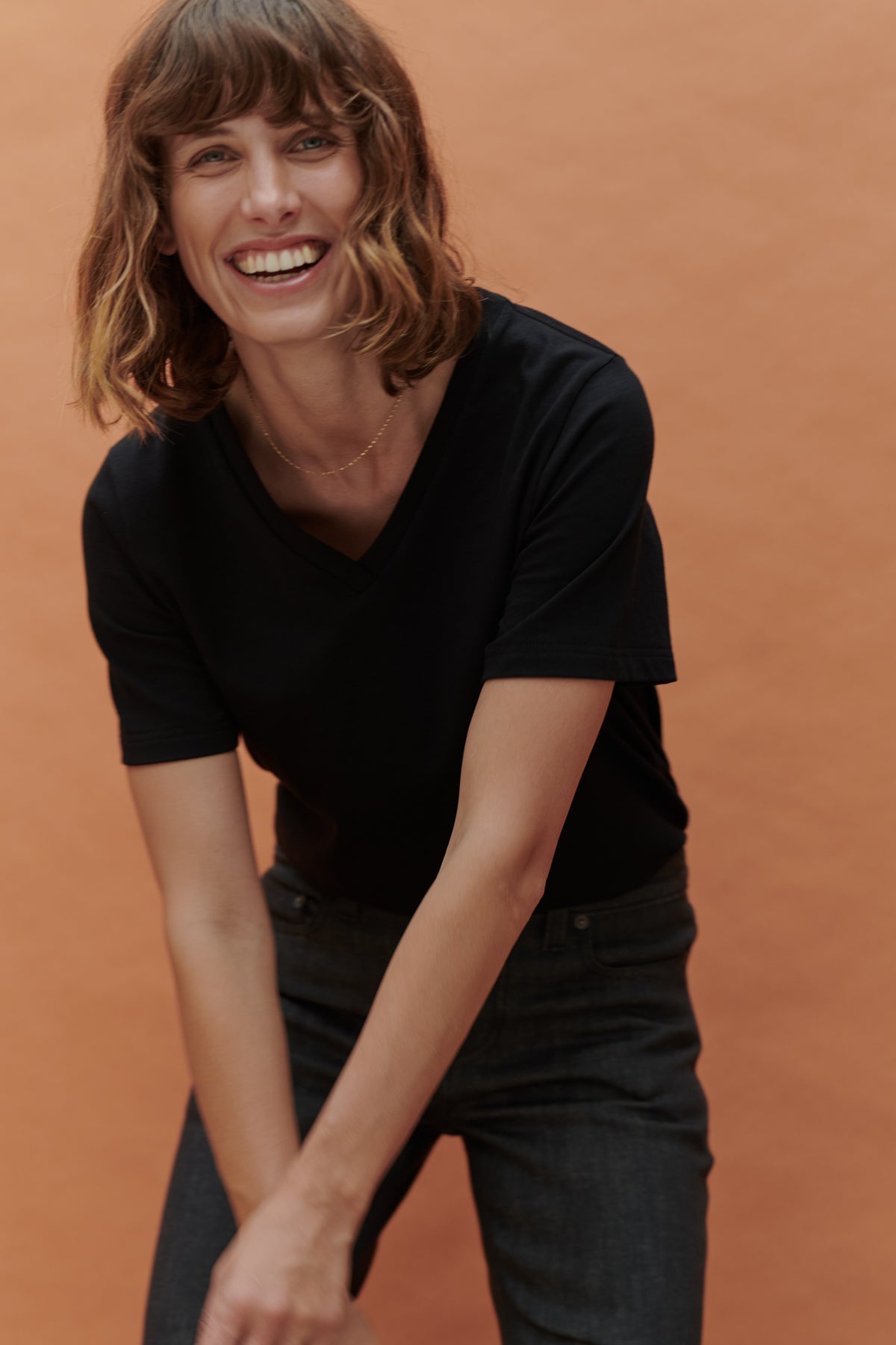 female wearing black v neck t shirt