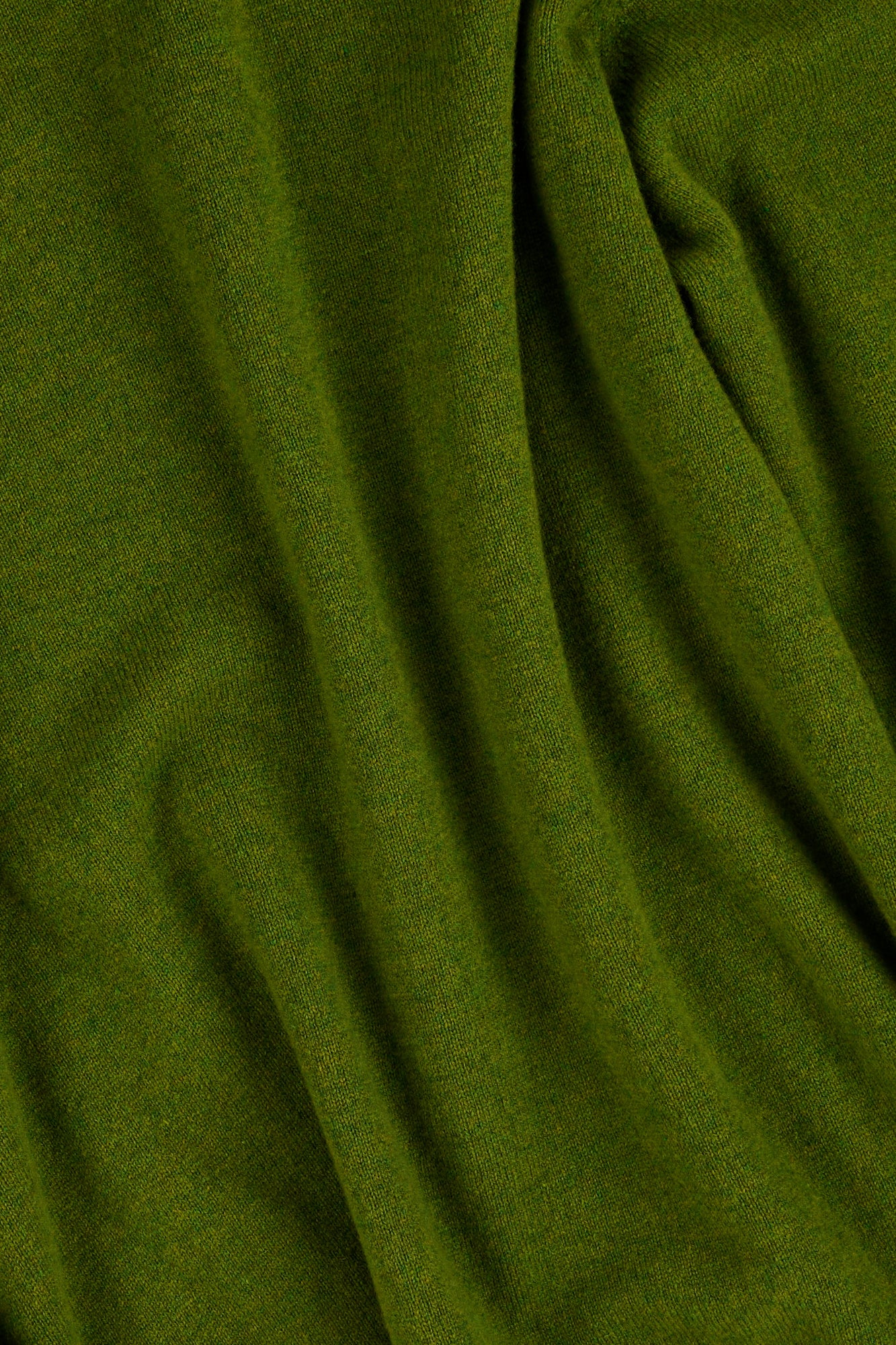 Close up of green lambswool knitted sweater.