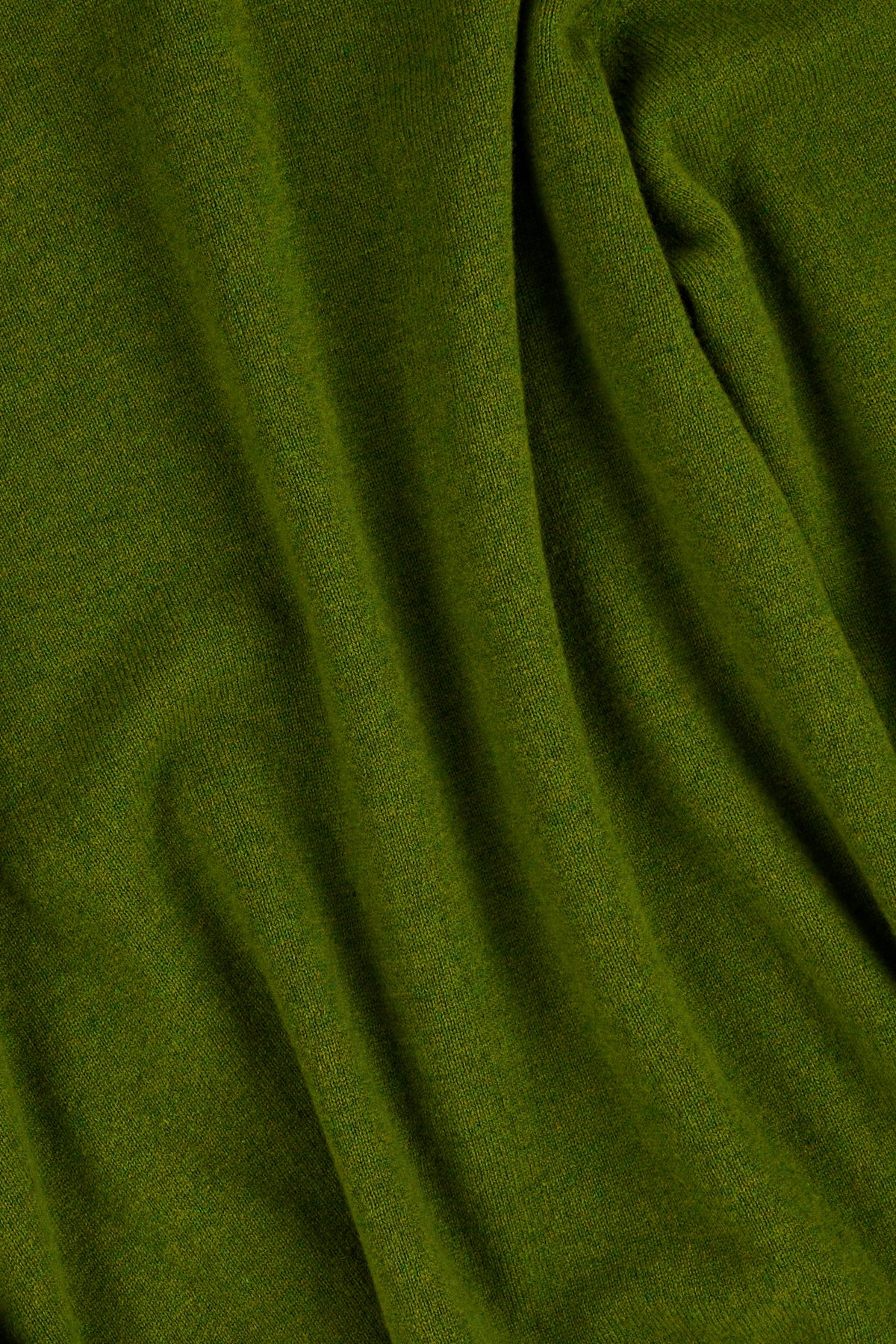 Close up of green lambswool knitted sweater.