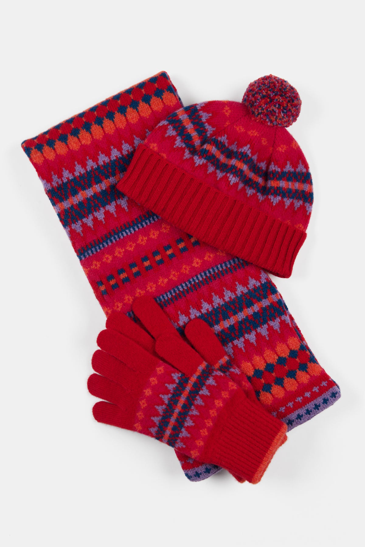 
            Fair isle design hat scarf and glove set in red with navy blue and purple details.