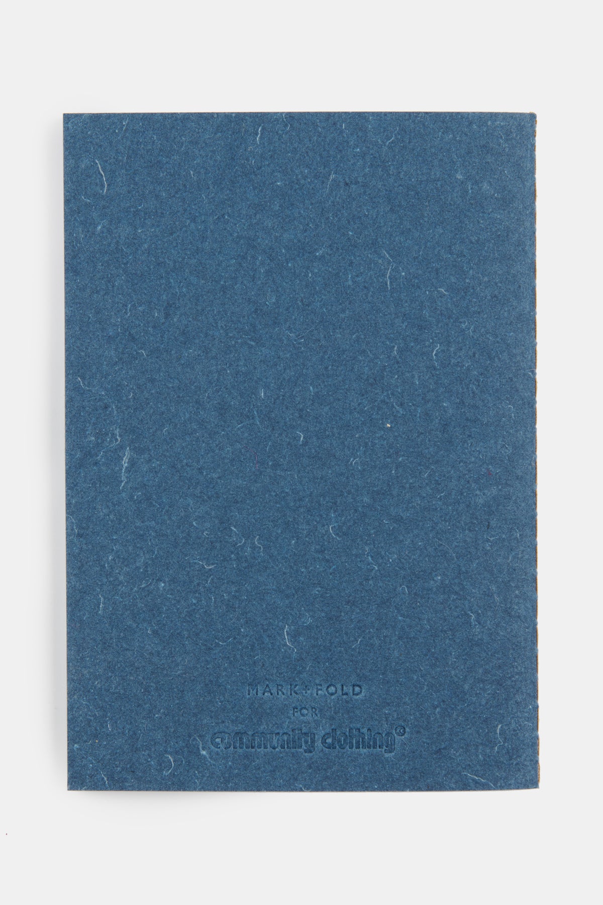The back of recycled denim notebook in indigo with embossed logo