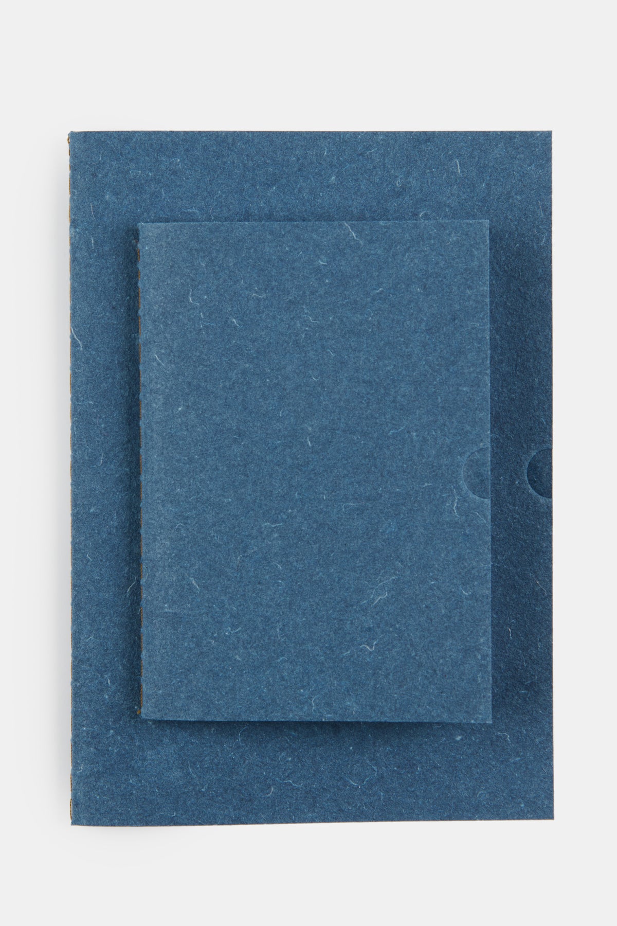 
            The front of A5 and A6 indigo notebook set.