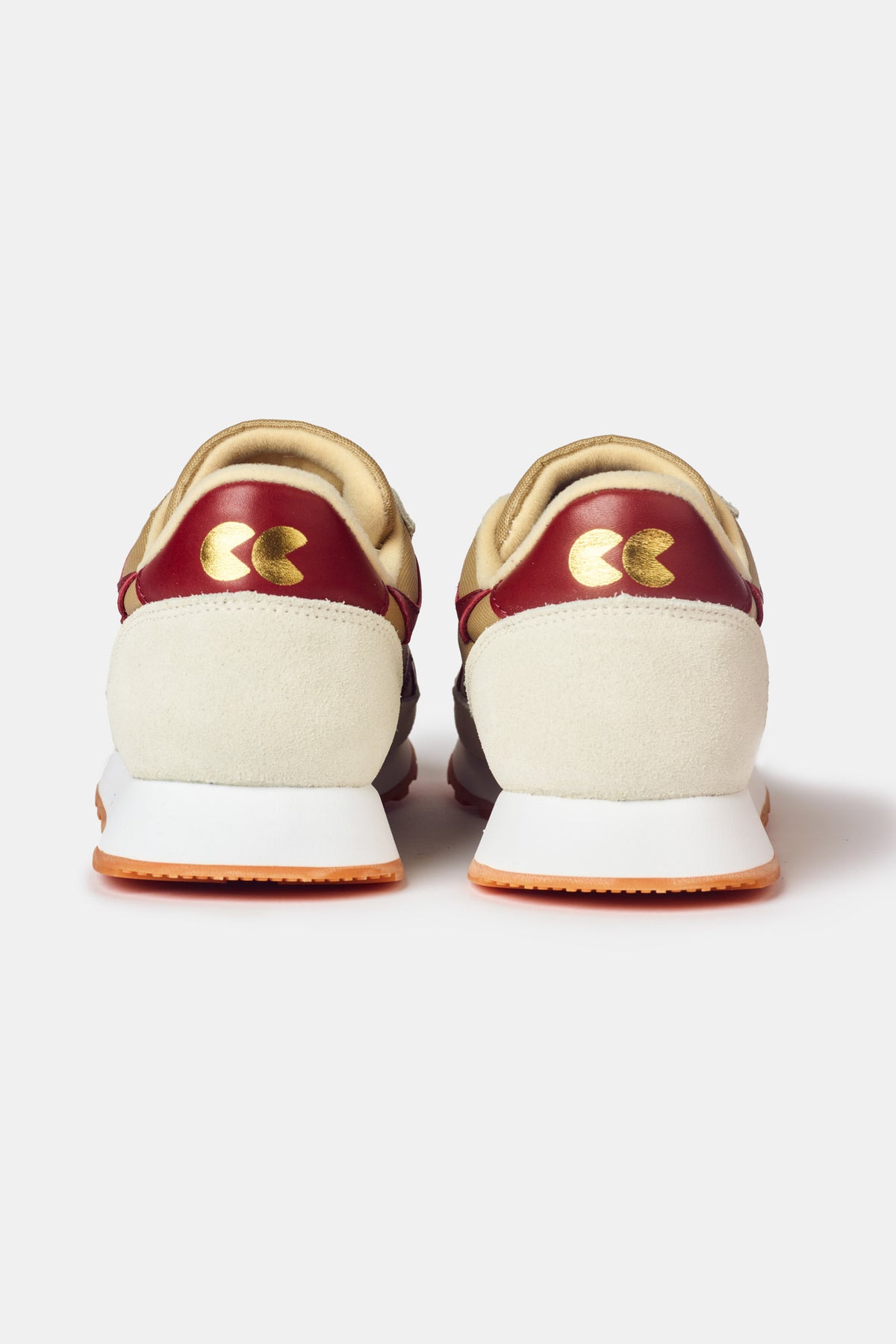 
            Men&#39;s Beacon Trainer in neutral. Neutral and red heal gold CC logo