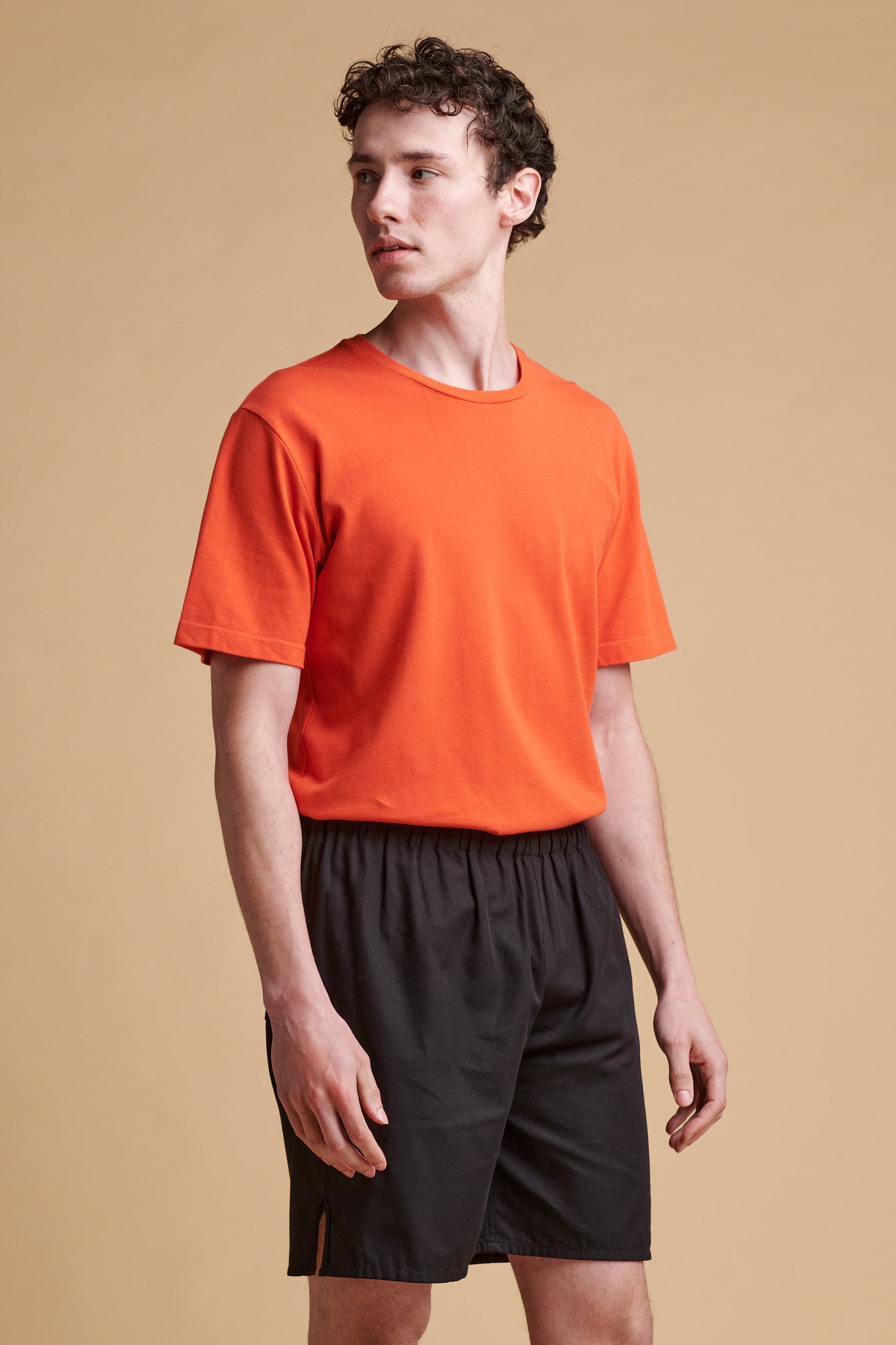 Male wearing breathable t shirt in flame red.