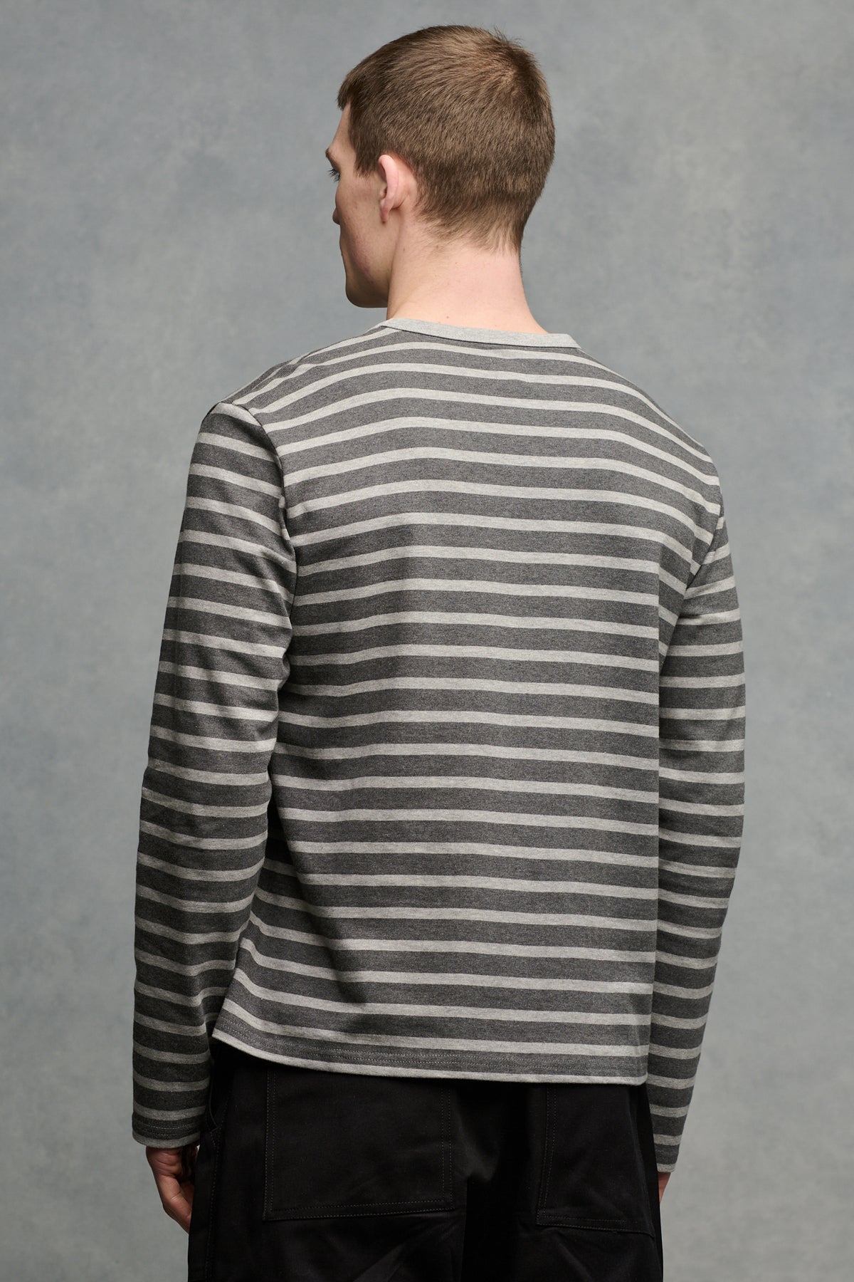 thigh up of the back of male wearing charcoal/grey Breton
