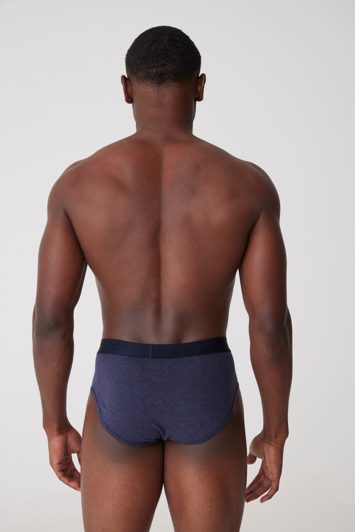 
            Black male facing away wearing only underwear brief in denim marl 