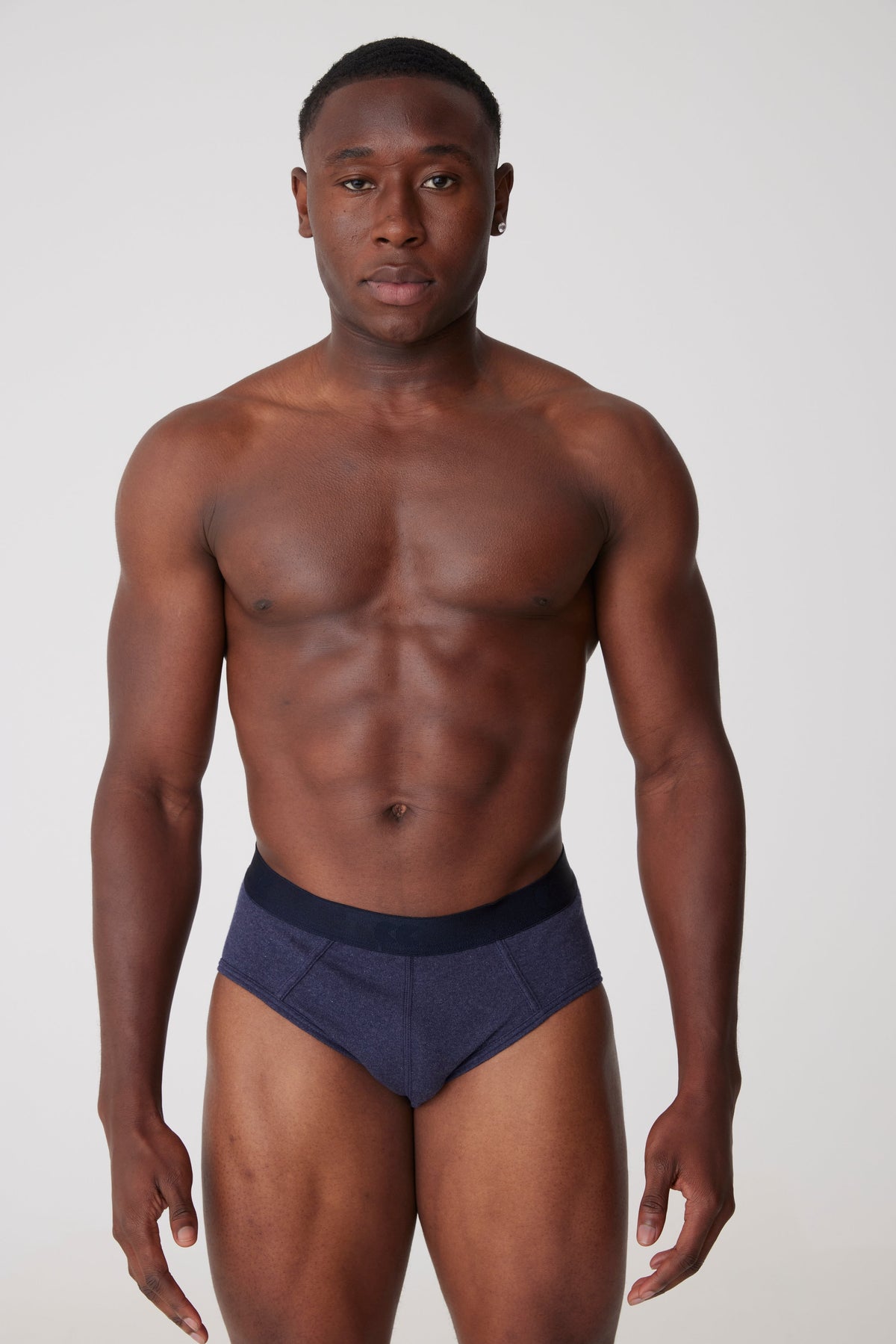 
            Black male wearing only underwear brief in denim marl