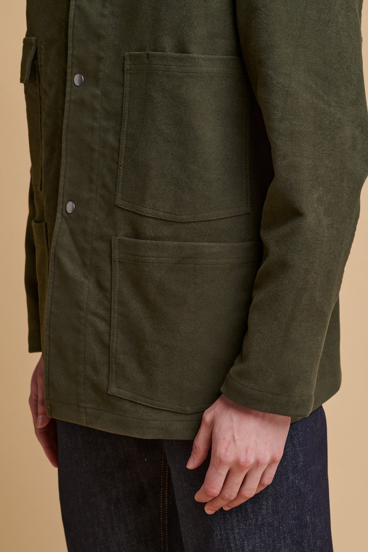 Details of front pockets on men's Carter moleskin chore jacket.