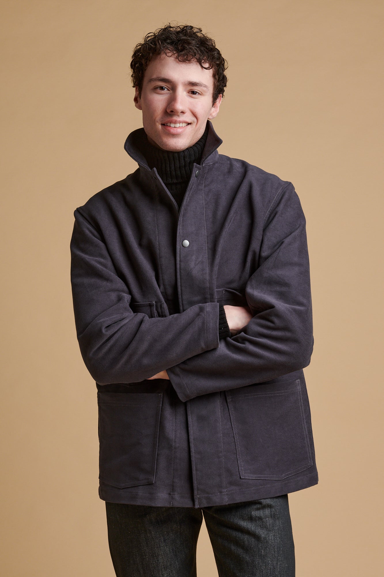 Male wearing Carter moleskin chore jacket in slate.