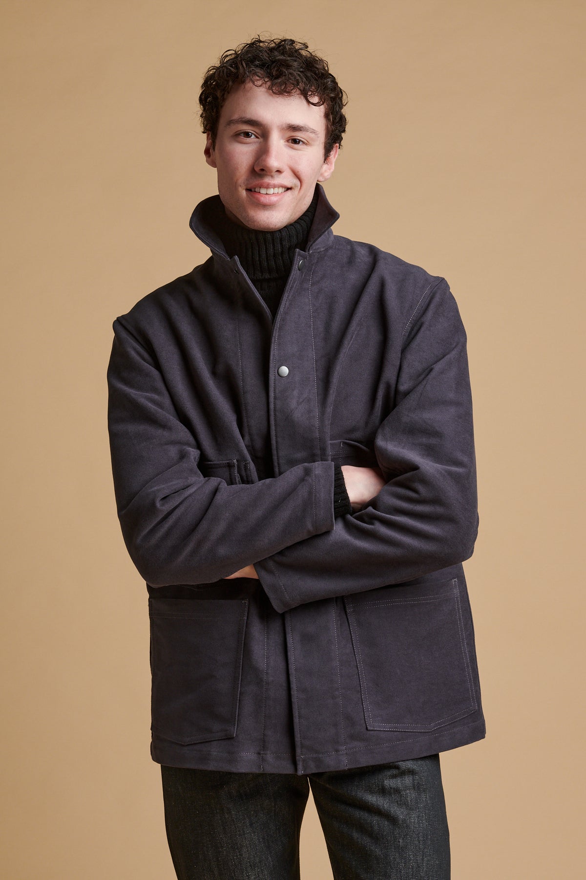 Male wearing Carter moleskin chore jacket in slate.