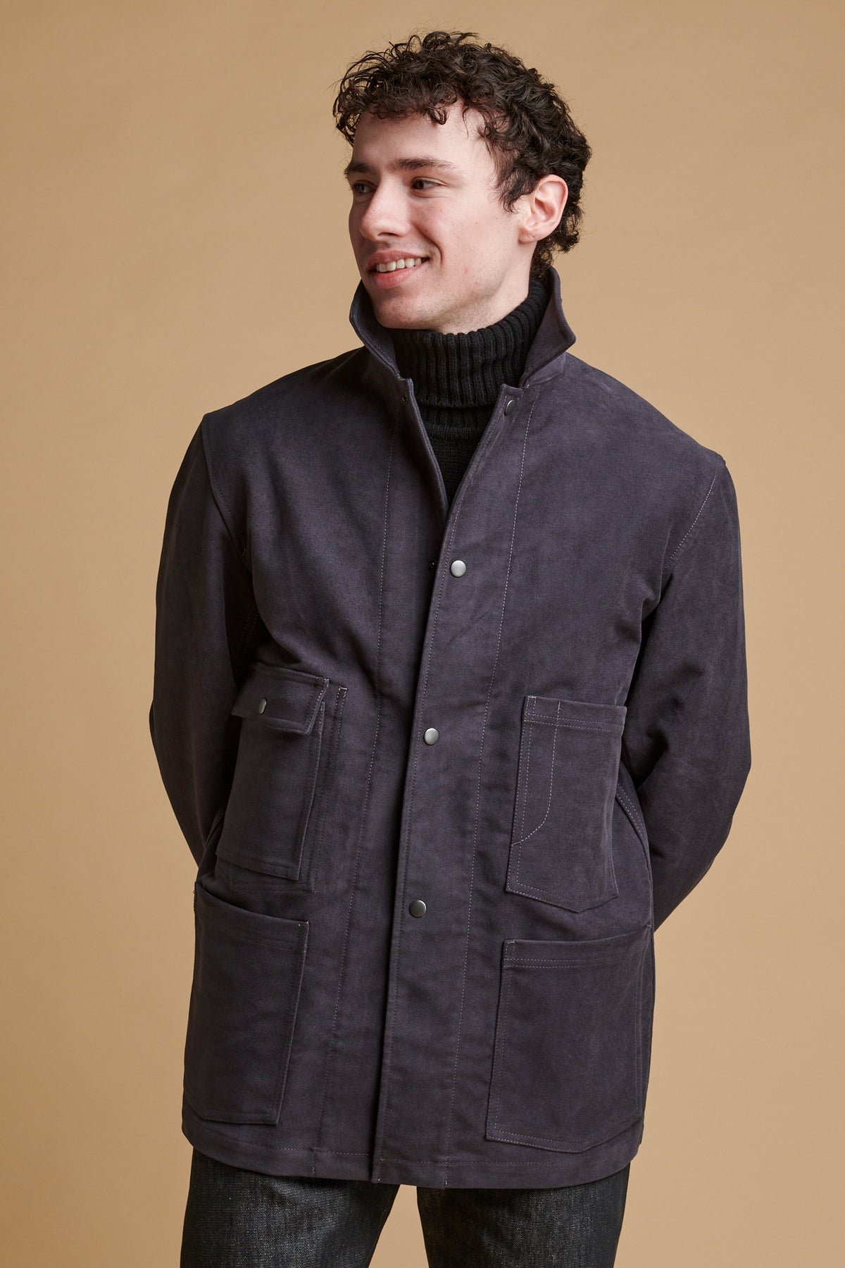 Male wearing Carter moleskin chore jacket in slate.