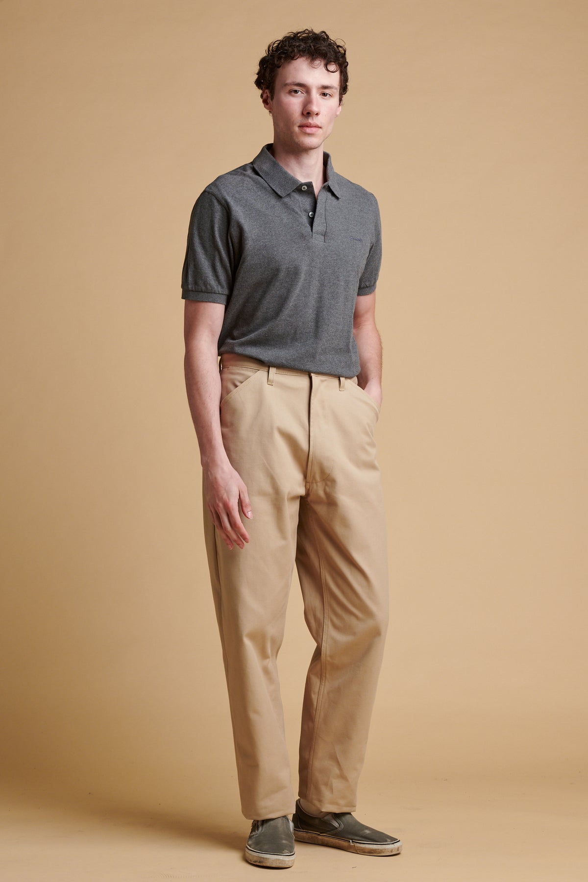 Male wearing chore heavyweight canvas trousers in putty.