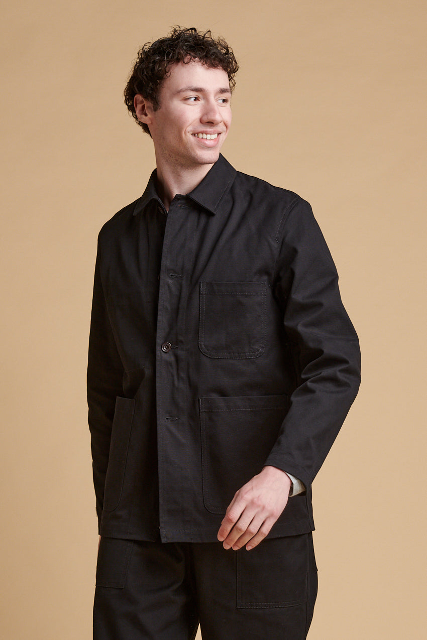 Male wearing chore jacket black.