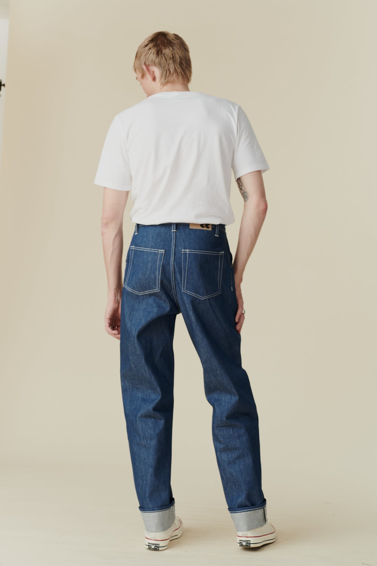 
            back of male wearing chore jean in blue