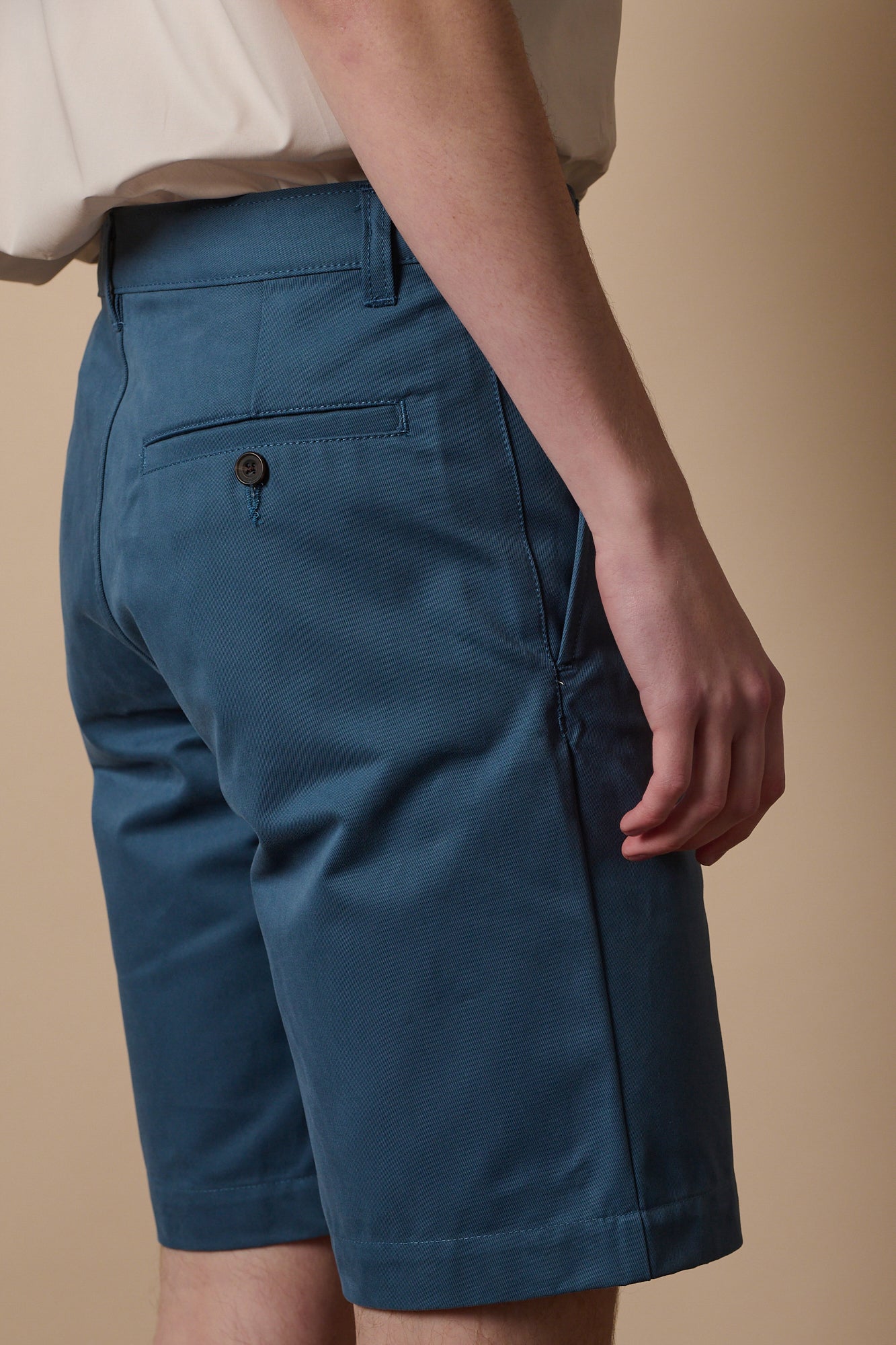 Blonde male wearing classic shorts in RAF blue