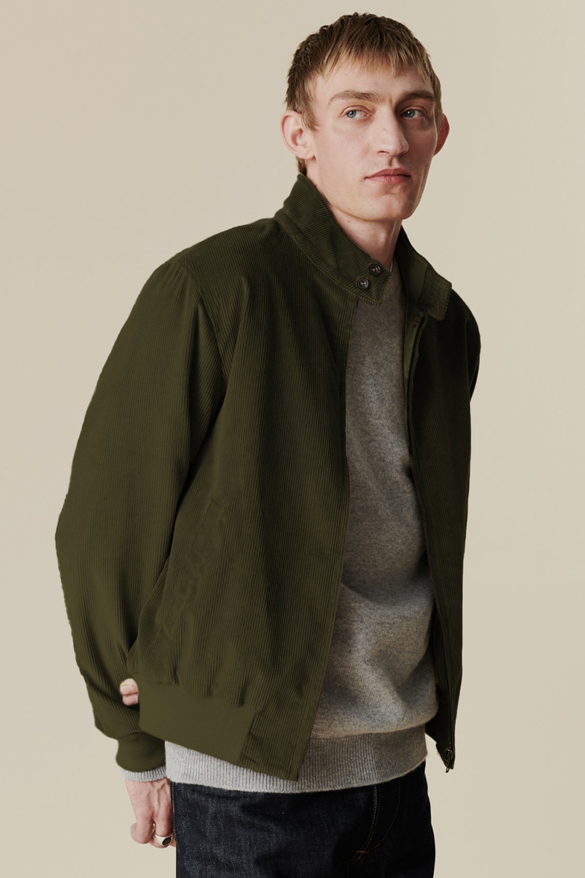 
            Thigh up shot of white male wearing men&#39;s corduroy Harrington in olive