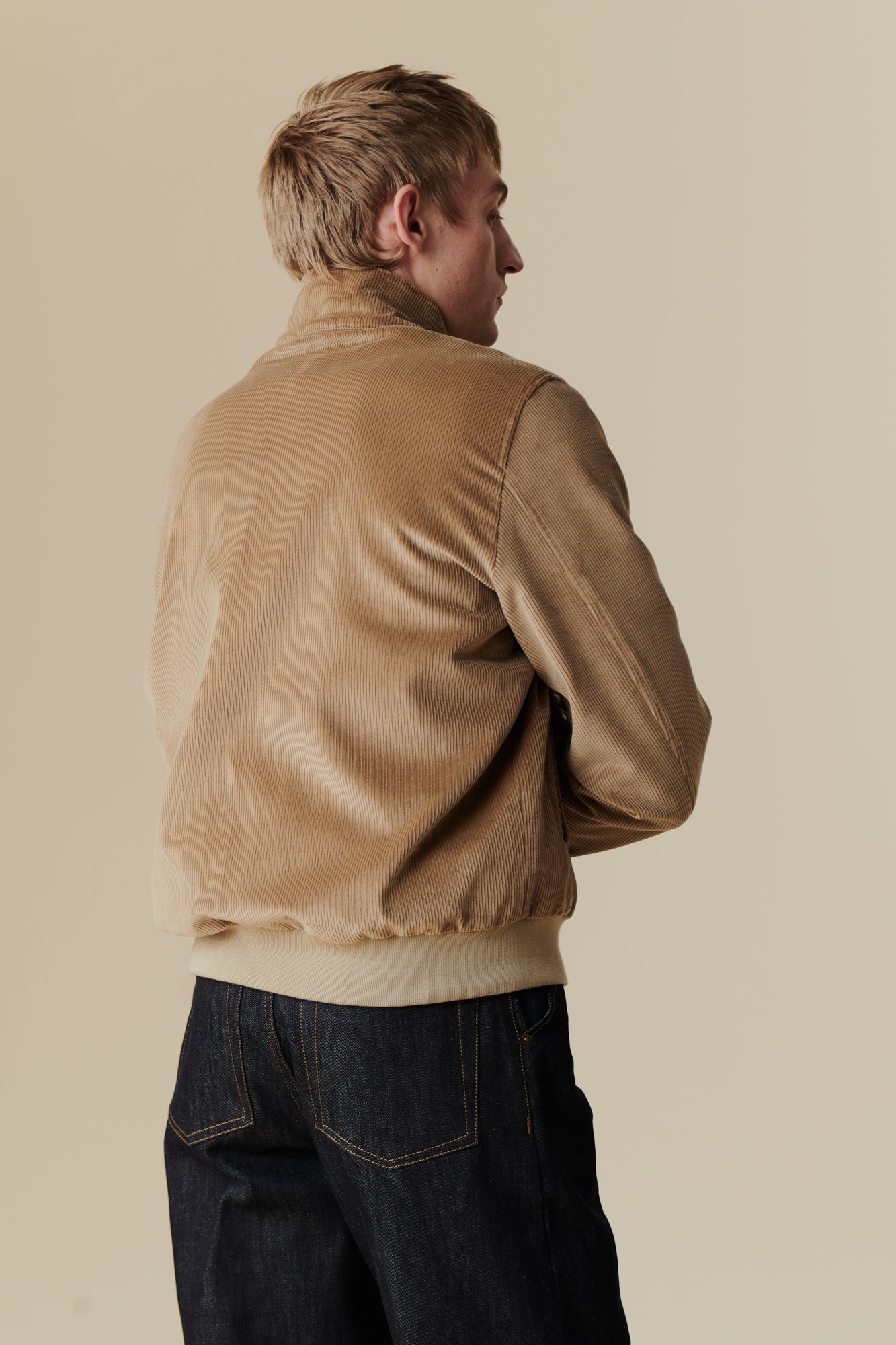 White male wearing corduroy harrington in stone
