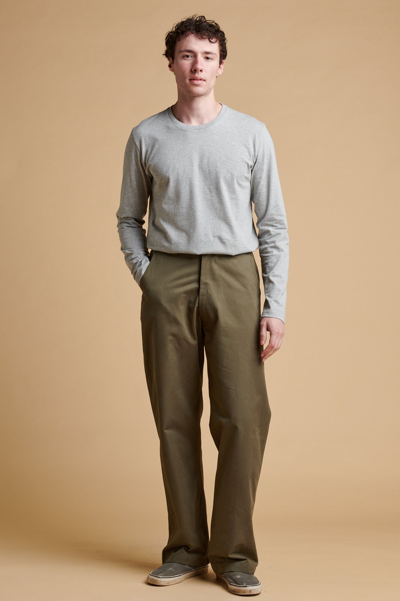 Male wearing field trousers in olive.