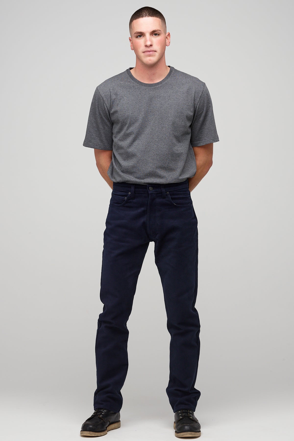 
            Brunette male in navy Five Pocket Moleskin Jean styled with charcoal short sleeve t-shirt