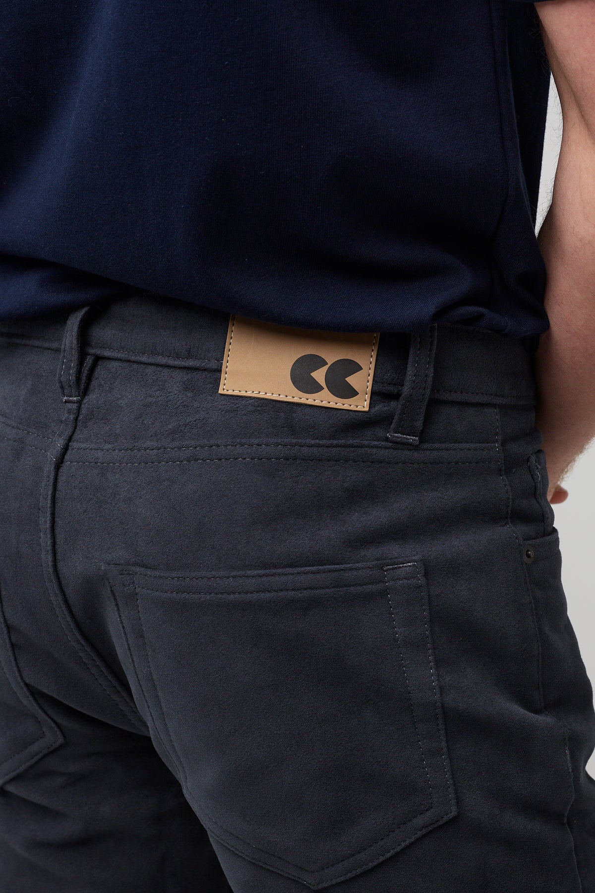 Brunette white male wearing navy Five Pocket Moleskin Jeans styled with navy short sleeve t-shirt and black shoes