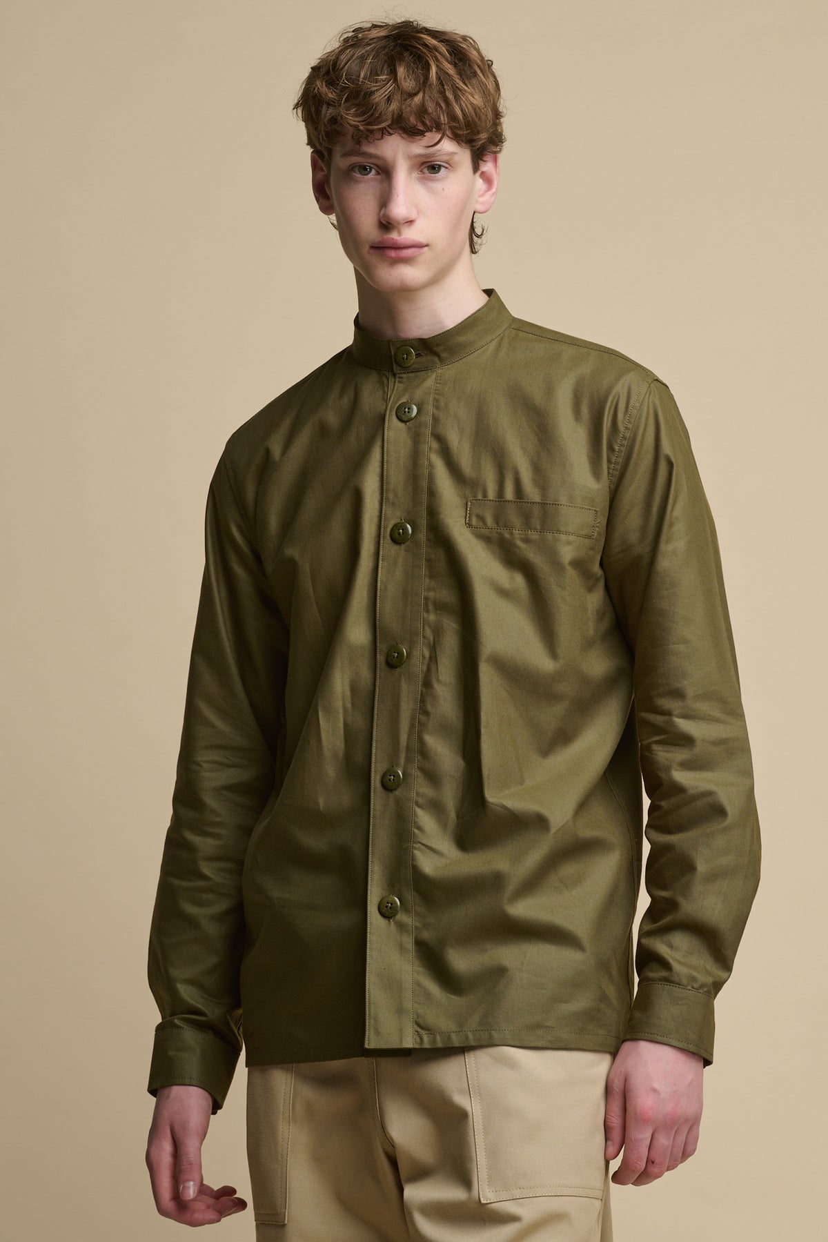 
            Male wearing buttoned up men&#39;s George Lightweight Collarless Overshirt in Olive