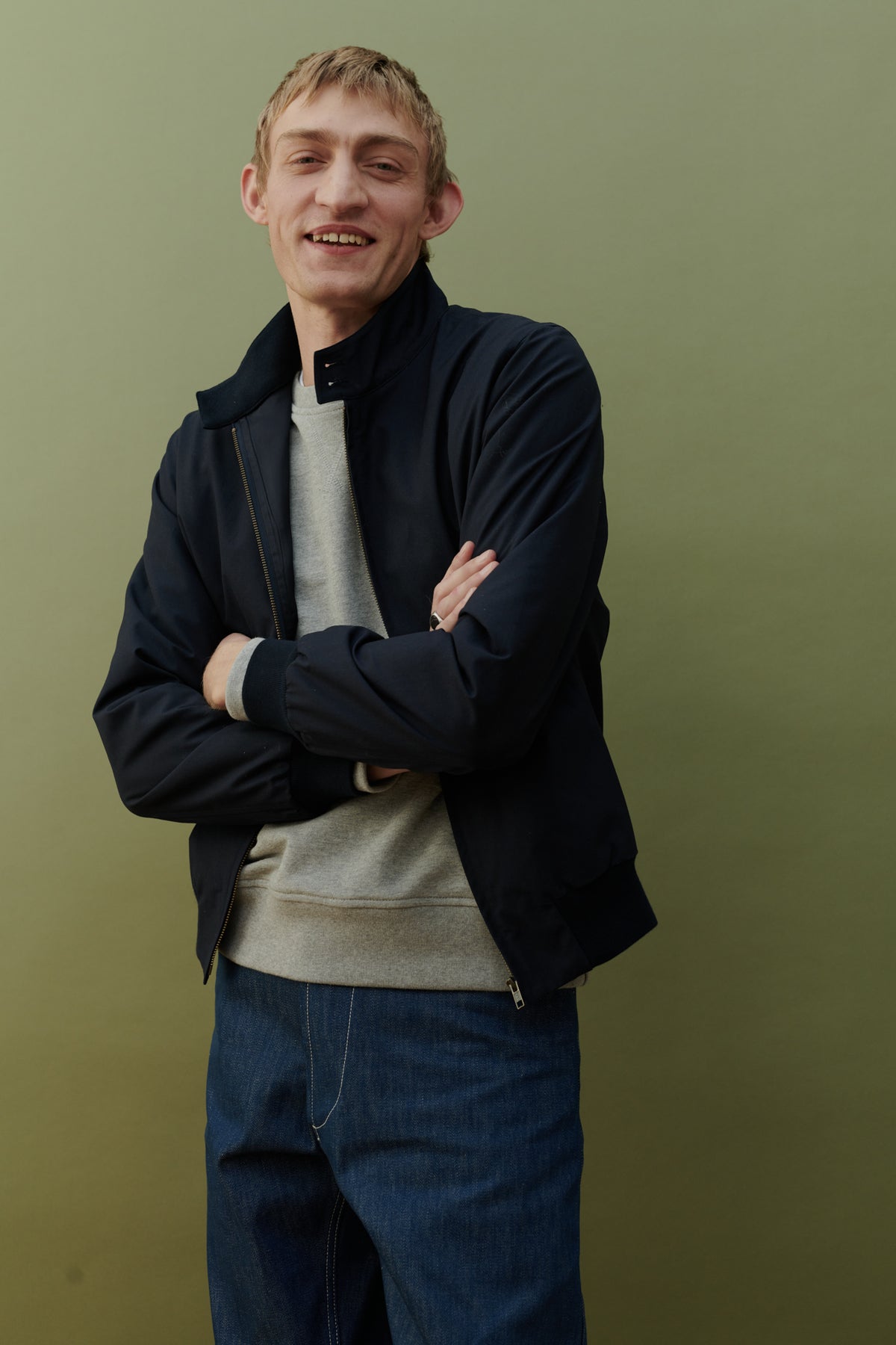 Male wearing Harrington jacket in navy