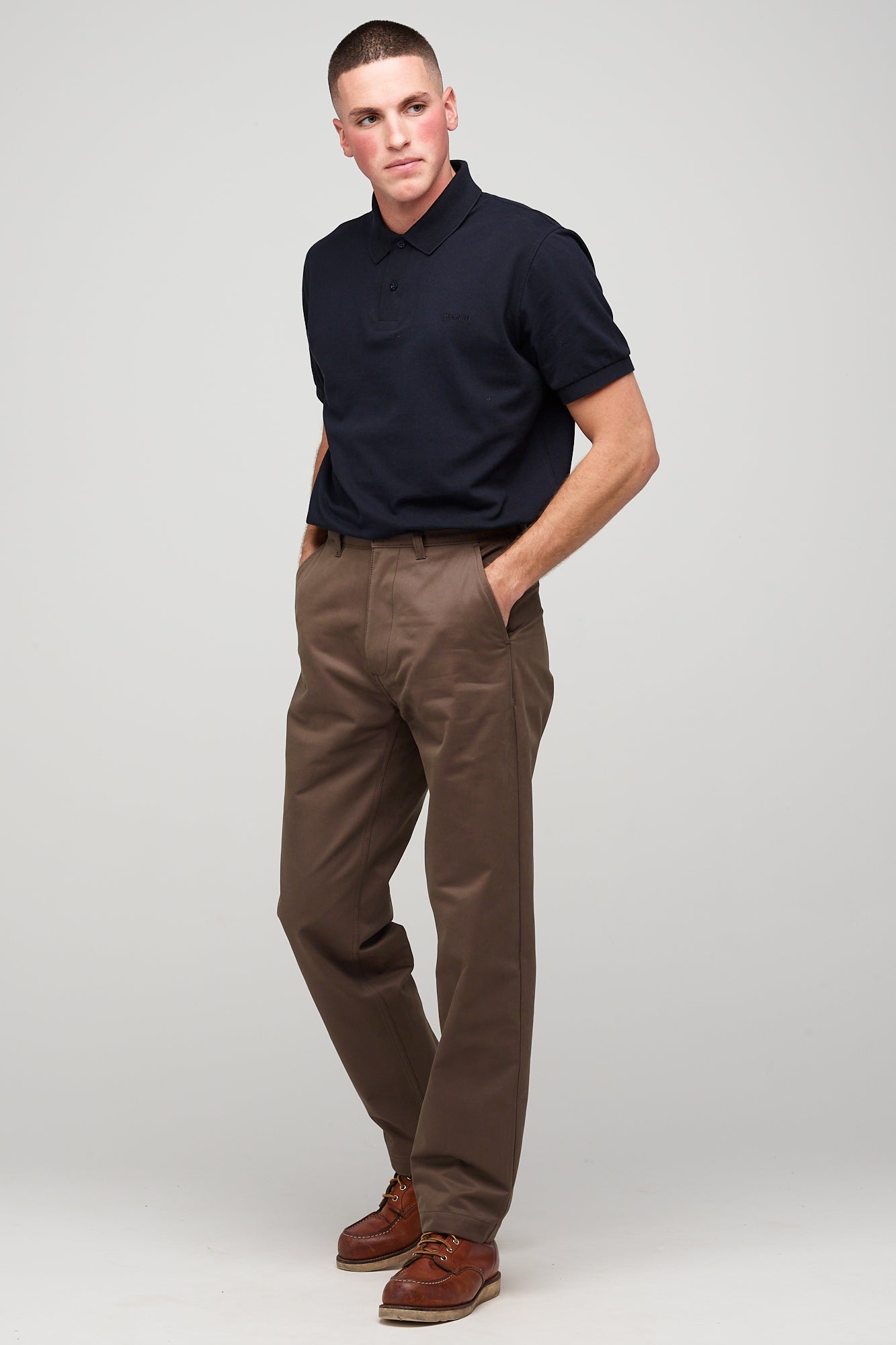 white brunette male in heavyweight relaxed chino brown styled with short sleeve polo shirt